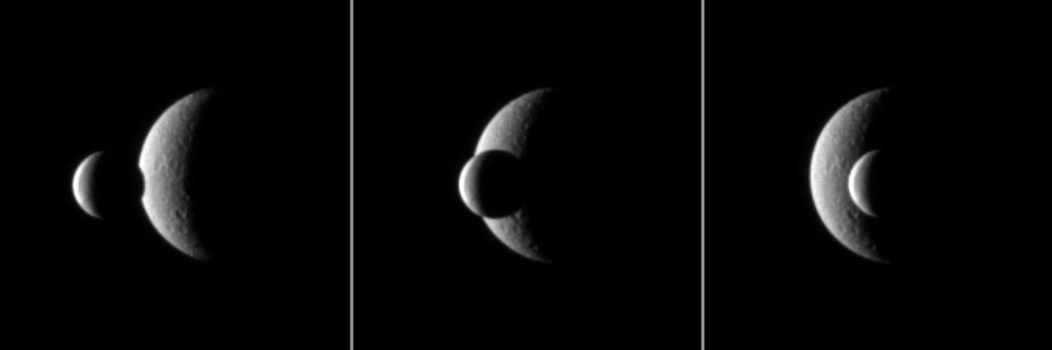 Two of Saturn's icy moons pass each other in a mutual event recorded by NASA's Cassini spacecraft. The smaller moon Enceladus passes in front of the larger moon Rhea.