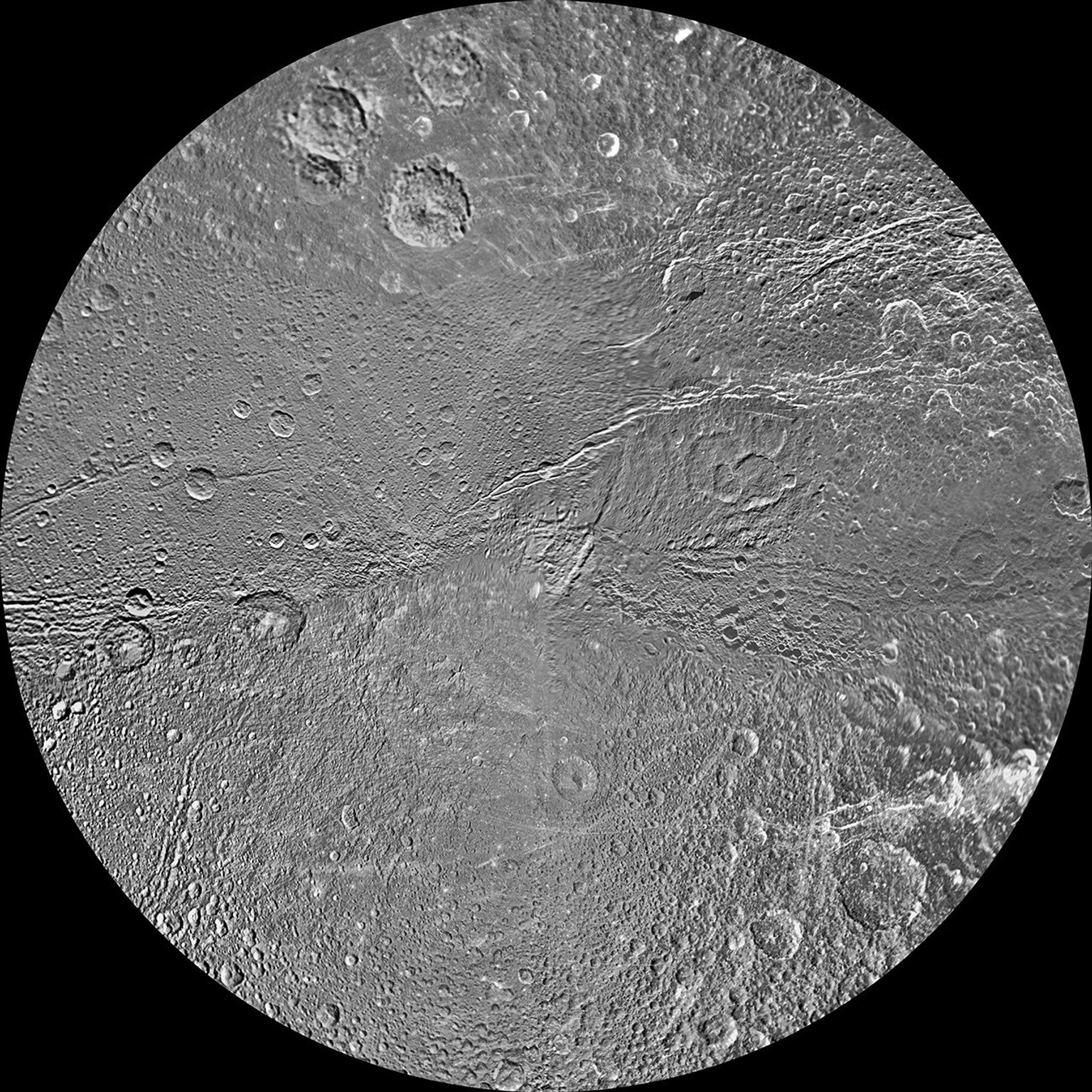 The southern hemisphere of Saturn's moon Dione is seen in this polar stereographic maps, mosaicked from the best-available clear-filter images from NASA's Cassini and Voyager missions.