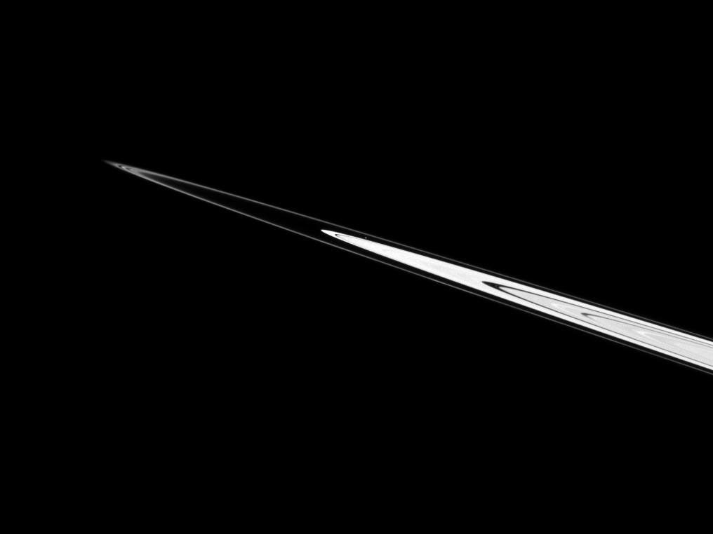 Atlas can be seen just above the center of this NASA Cassini spacecraft image as the moon orbits in the Roche Division between Saturn's A ring and thin F ring.