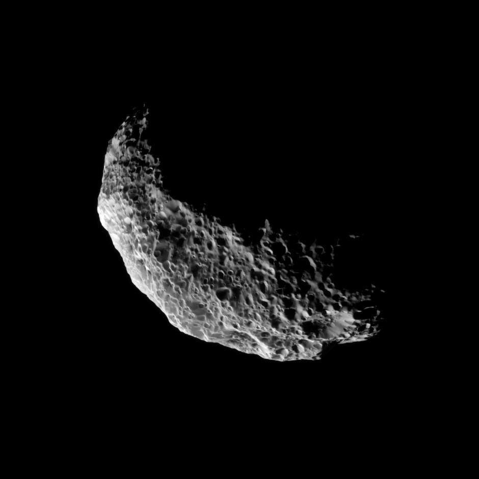 NASA's Cassini spacecraft captures a view of the southern latitudes of Saturn's tumbling moon Hyperion. Lit terrain seen here is mostly in the southern hemisphere of Hyperion. The south pole of the moon is near the bottom of the illuminated terrain.