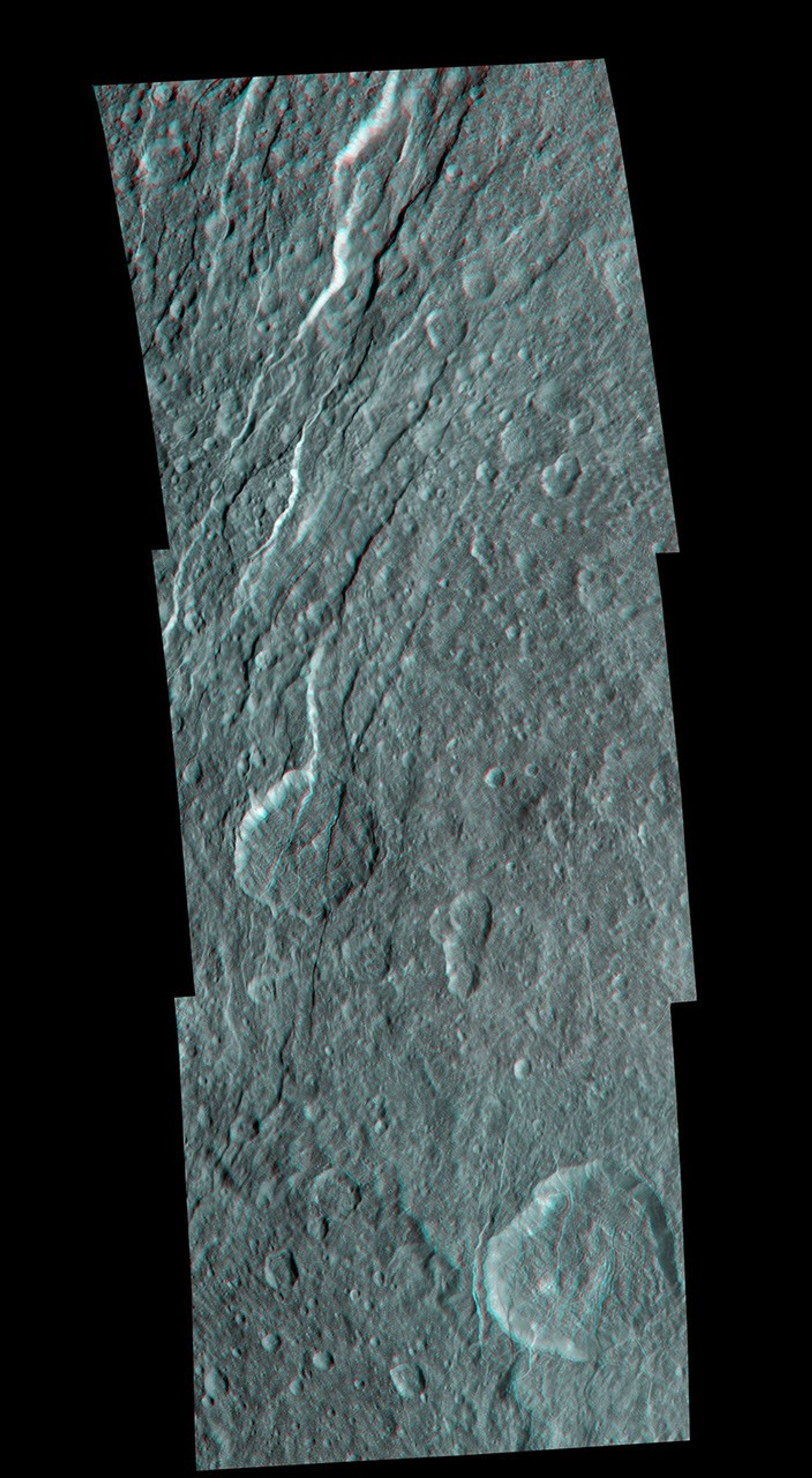 Wispy fractures cut through cratered terrain on Saturn's moon Rhea in this high resolution, 3-D image from NASA's Cassini spacecraft. 3D glasses are necessary to identify surface detail.