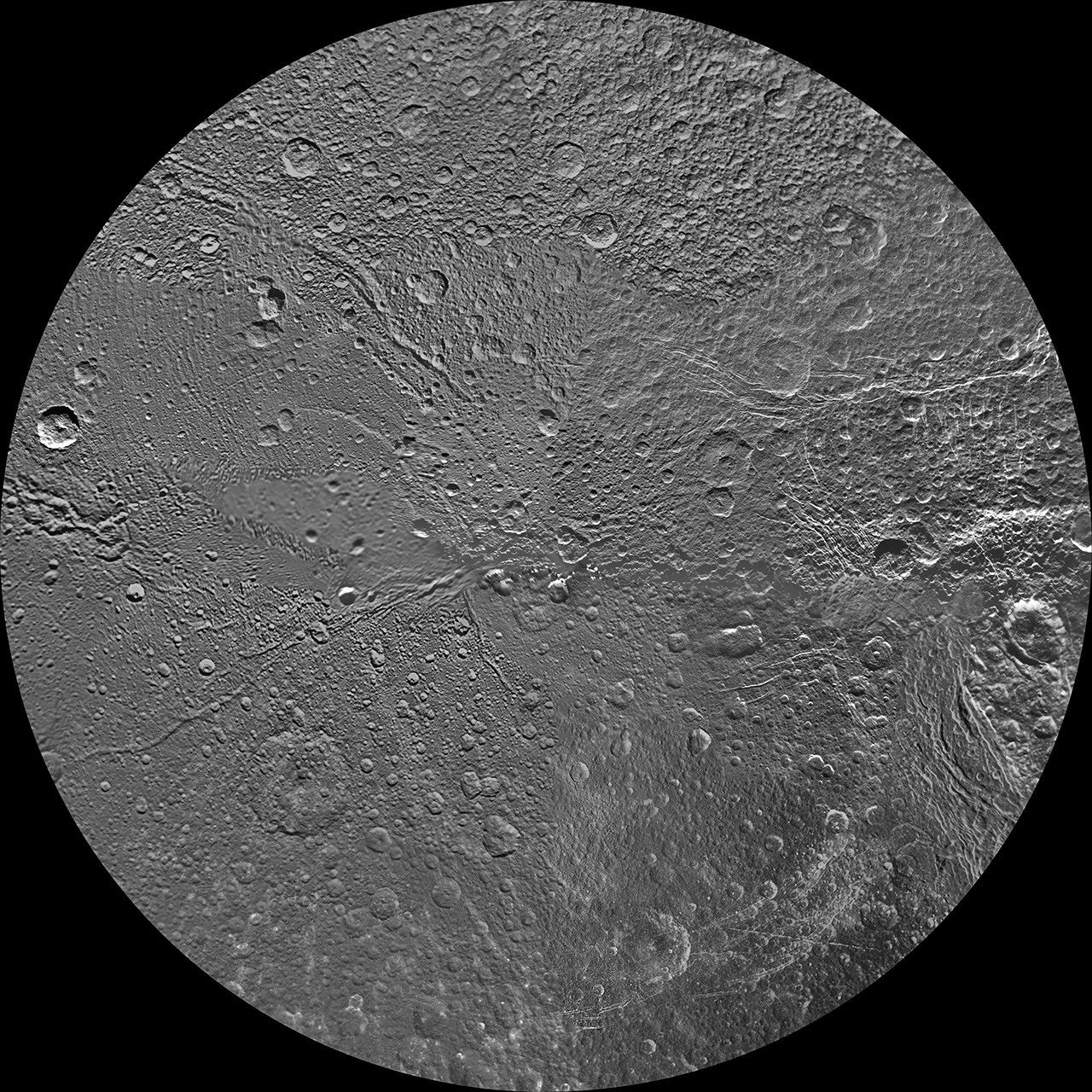 The northern and southern hemispheres of Dione are seen in these polar stereographic maps of the north pole, mosaicked from the best-available clear-filter images from NASA's Cassini and Voyager missions.