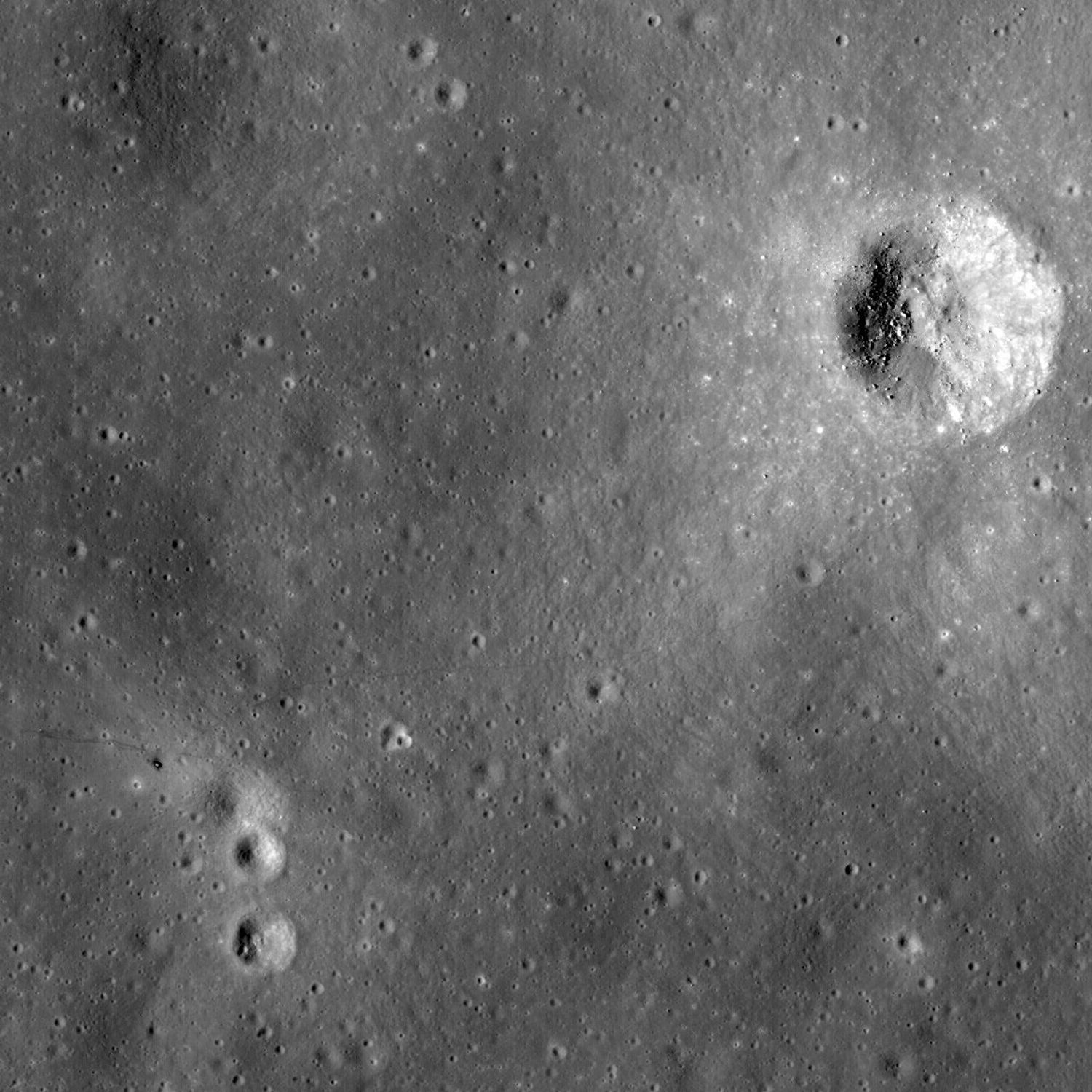 This uncalibrated image from NASA's Lunar Reconnaissance Orbiter's shows the Apollo 14 landing site and nearby Cone crater. The trail followed by the astronauts can clearly be discerned.