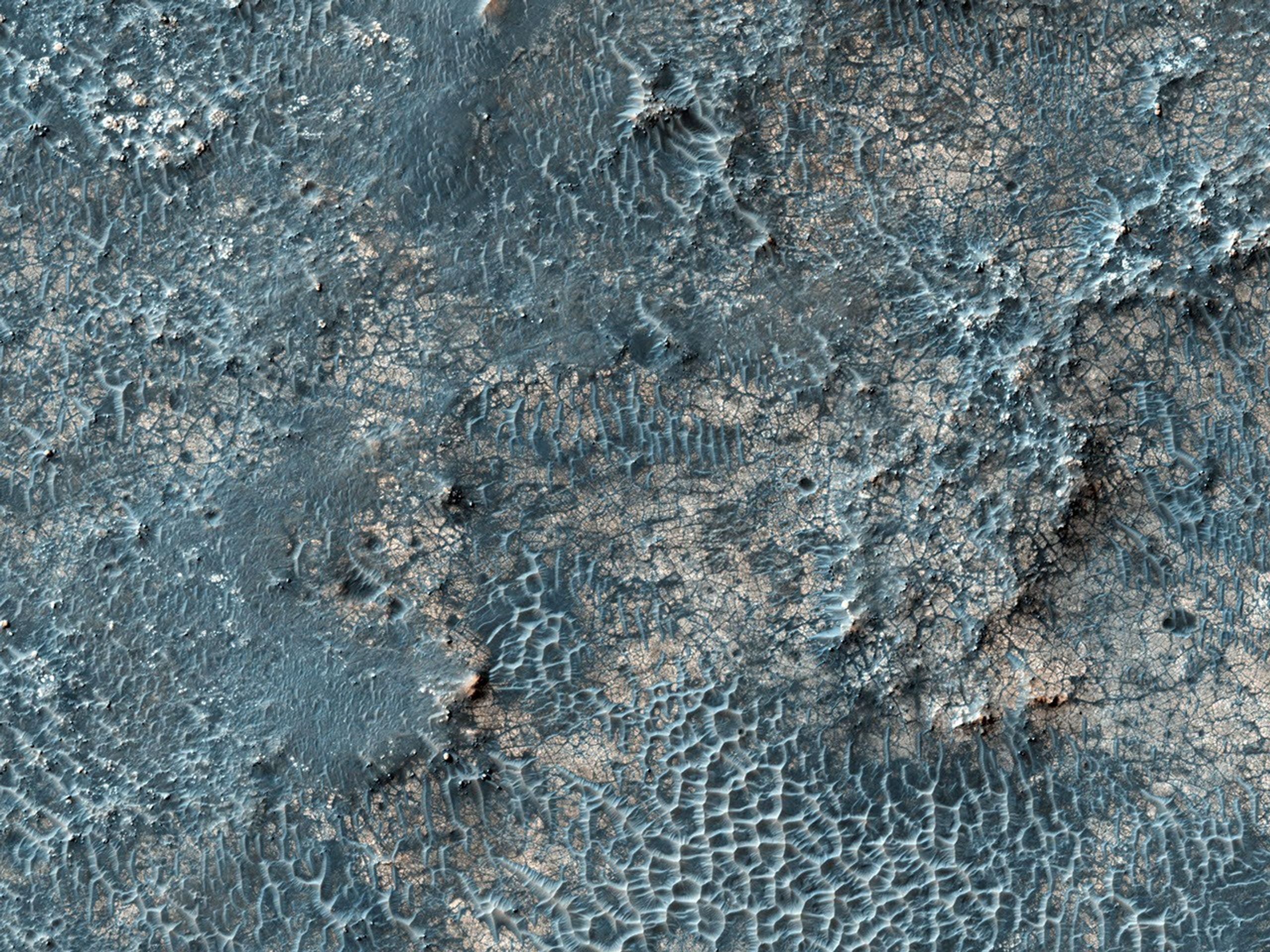 This image taken by NASA's Mars Reconnaissance Orbiter covers part of a candidate landing site that appears to be a shallow depression with a deposit perhaps consisting of chlorides, like table salt.