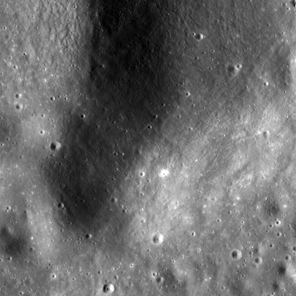 This NASA Lunar Reconnaissance Orbiter (LRO) image is of the summit crater of Hortensius Dome Phi. Summit craters of all the Hortensius Domes show no raised rims and are not circular, indicating they are analogous to volcanic calderas.