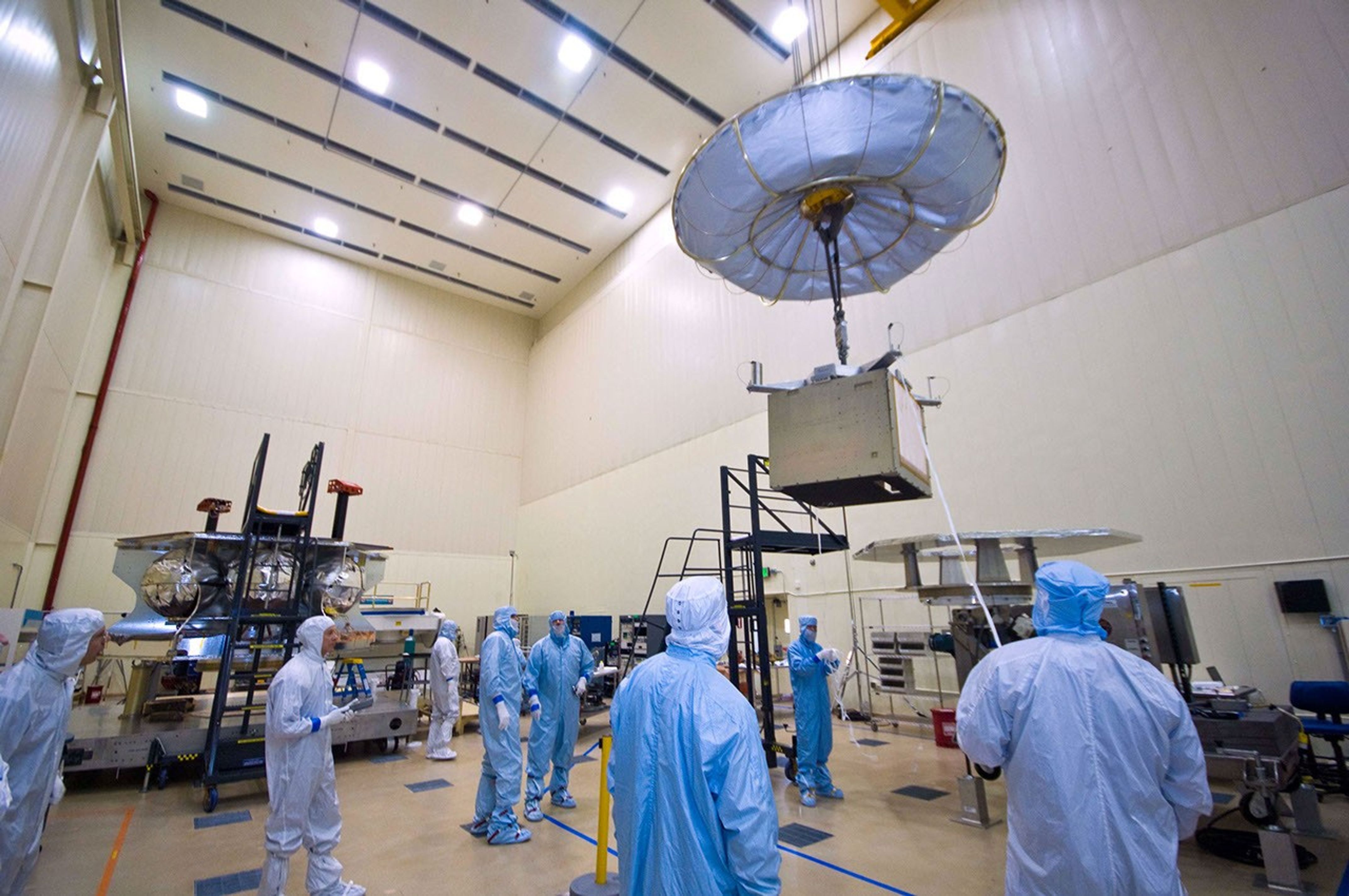 Assembly began April 1, 2010, for NASA's Juno spacecraft. Workers at Lockheed Martin Space Systems in Denver, Colorado are moving into place the vault that will protect the spacecraft's sensitive electronics from Jupiter's intense radiation belts.
