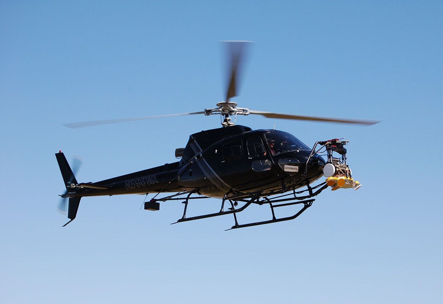 This image, taken April 9, 2010, shows the test radar affixed to a gimbal mounting at the front of a helicopter, carrying an engineering test model of the landing radar for NASA's Mars Science Laboratory.
