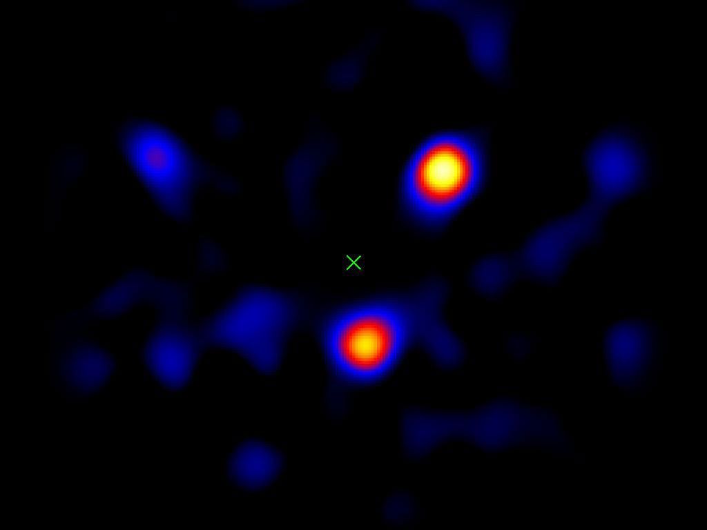 This image taken with the Palomar Observatory's Hale Telescope, shows the light from three planets orbiting a star 120 light-years away. The planets' star, called HR8799, is located at the spot marked with an 'X.'