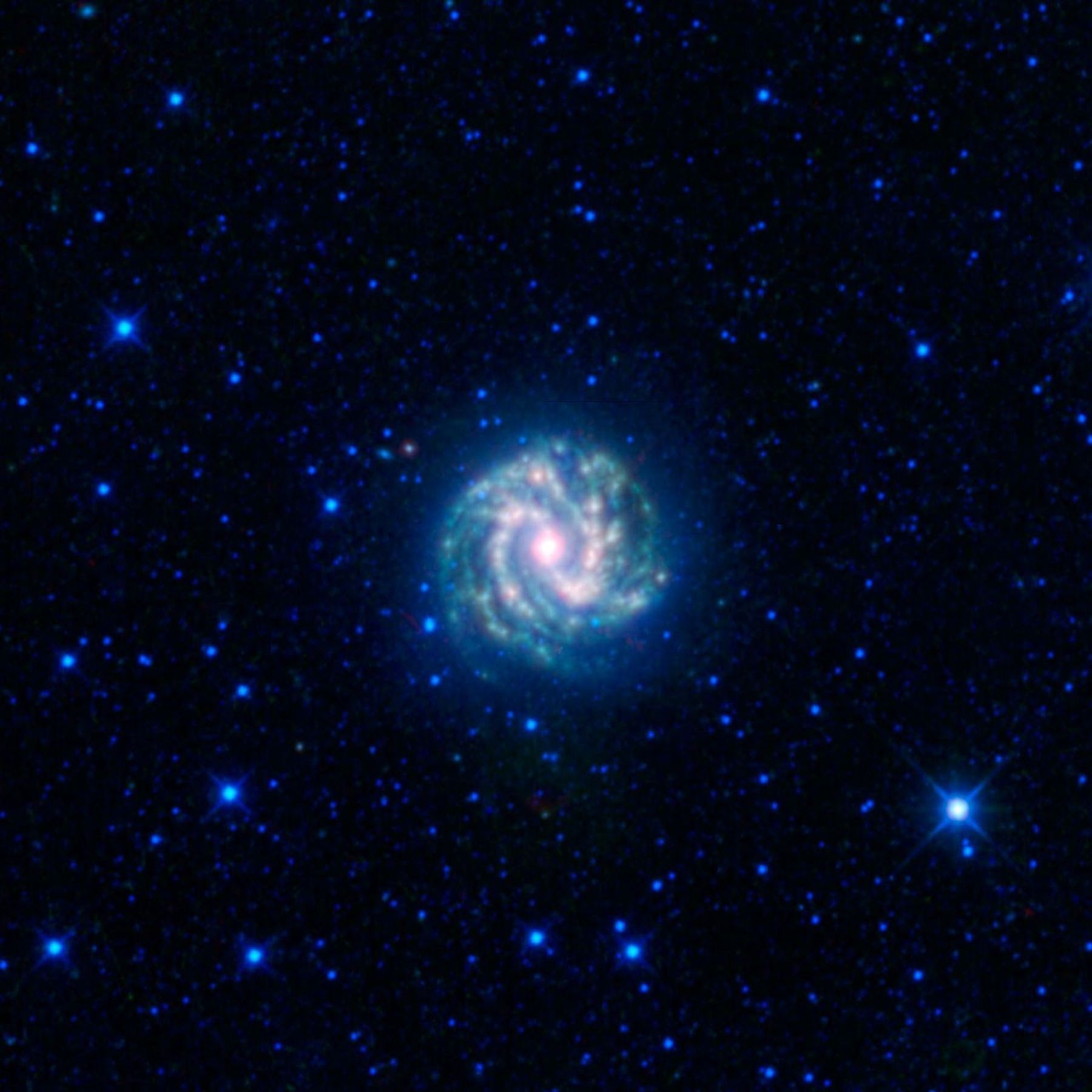 This image from NASA's Wide-field Infrared Survey Explorer shows the nearby galaxy M83. This is a spiral galaxy approximately 15 million light-years away in the constellation Hydra, sometimes referred to as the southern Pinwheel galaxy.