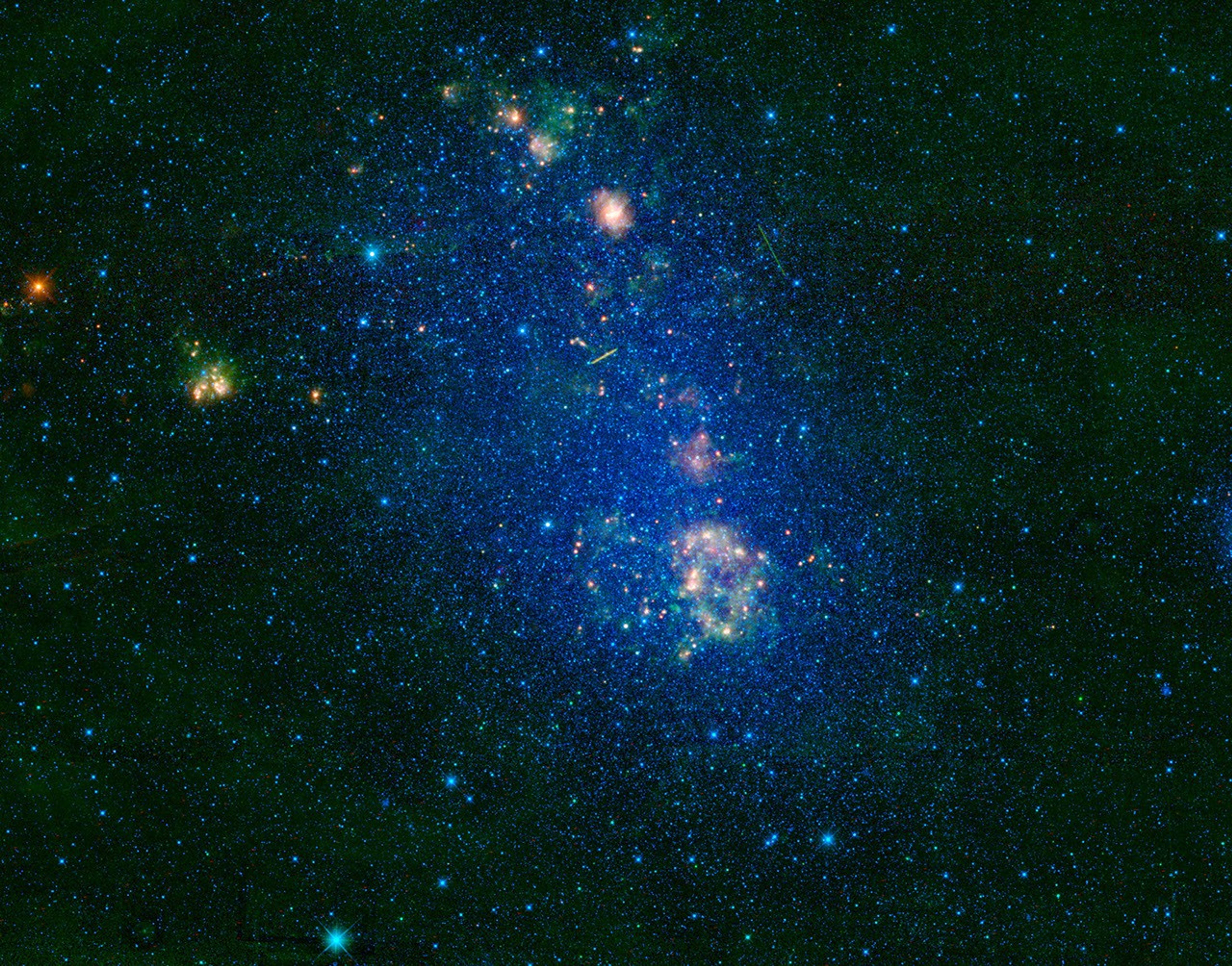 NASA's Wide-field Infrared Survey Explorer highlights the Small Magellanic Cloud, a small galaxy about 200,000 light-years away. Located in the constellation Tucana, the Small Magellanic Cloud looks like a wispy cloud encircling the south celestial pole.