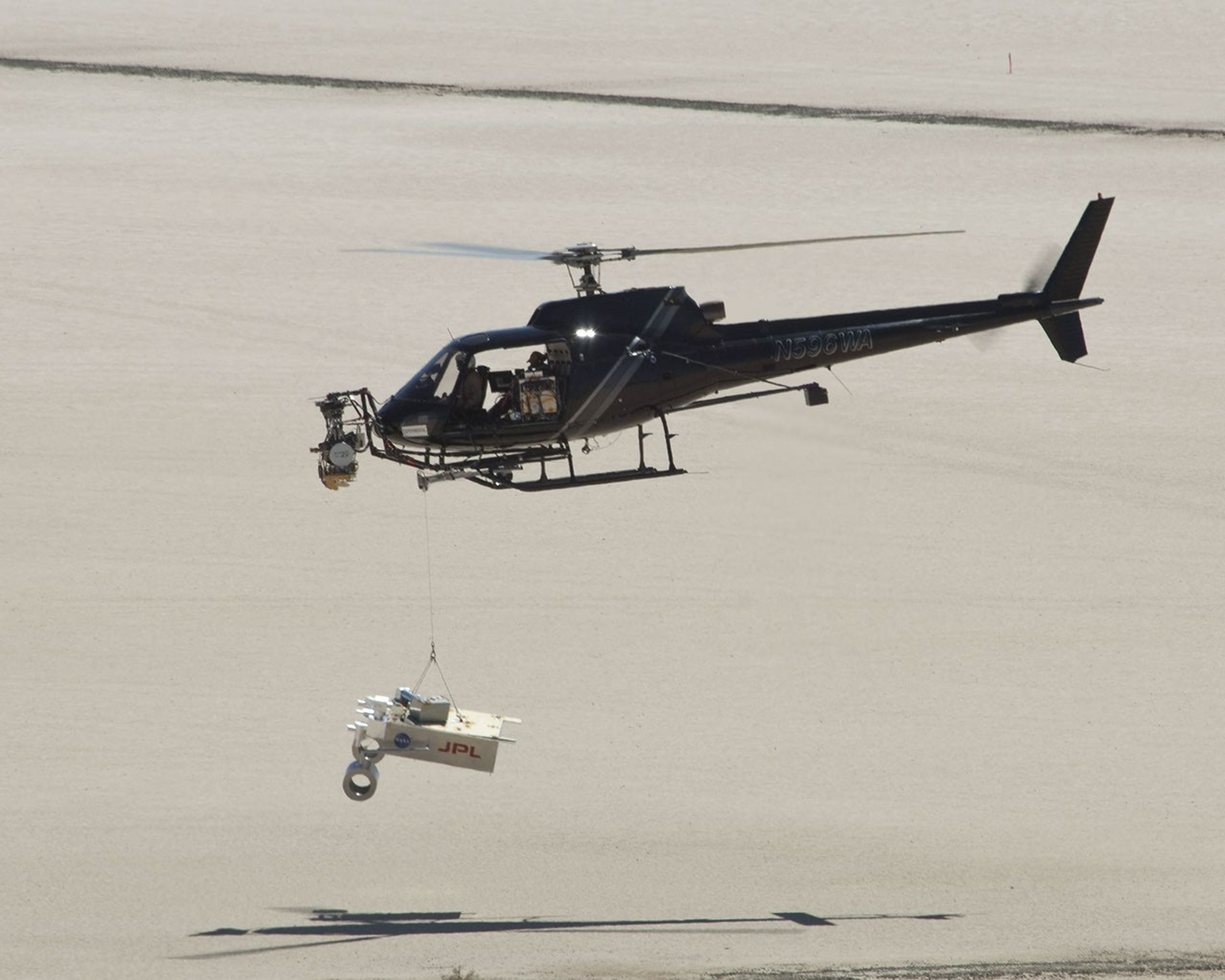 This test for the radar system to be used during the August 2012 descent and landing of NASA Mars rover Curiosity mounted an engineering test model of the radar system onto the nose of a helicopter.