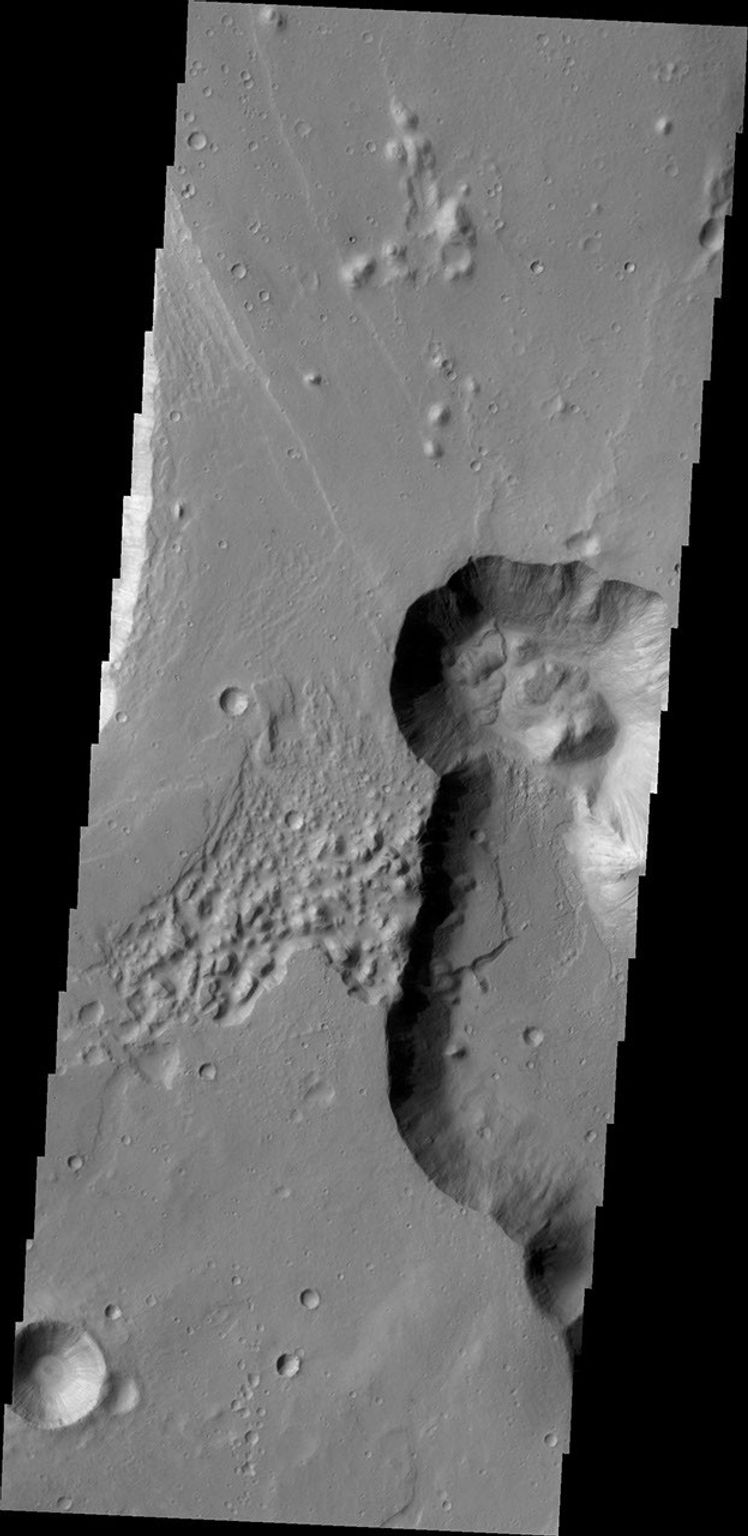 This image of part of Chryse Chaos shows landslide deposits at the head of the canyon. Chryse Chaos is part of a huge outflow channel on Mars. NASA's 2001 Mars Odyssey captured this image on May 6, 2010.