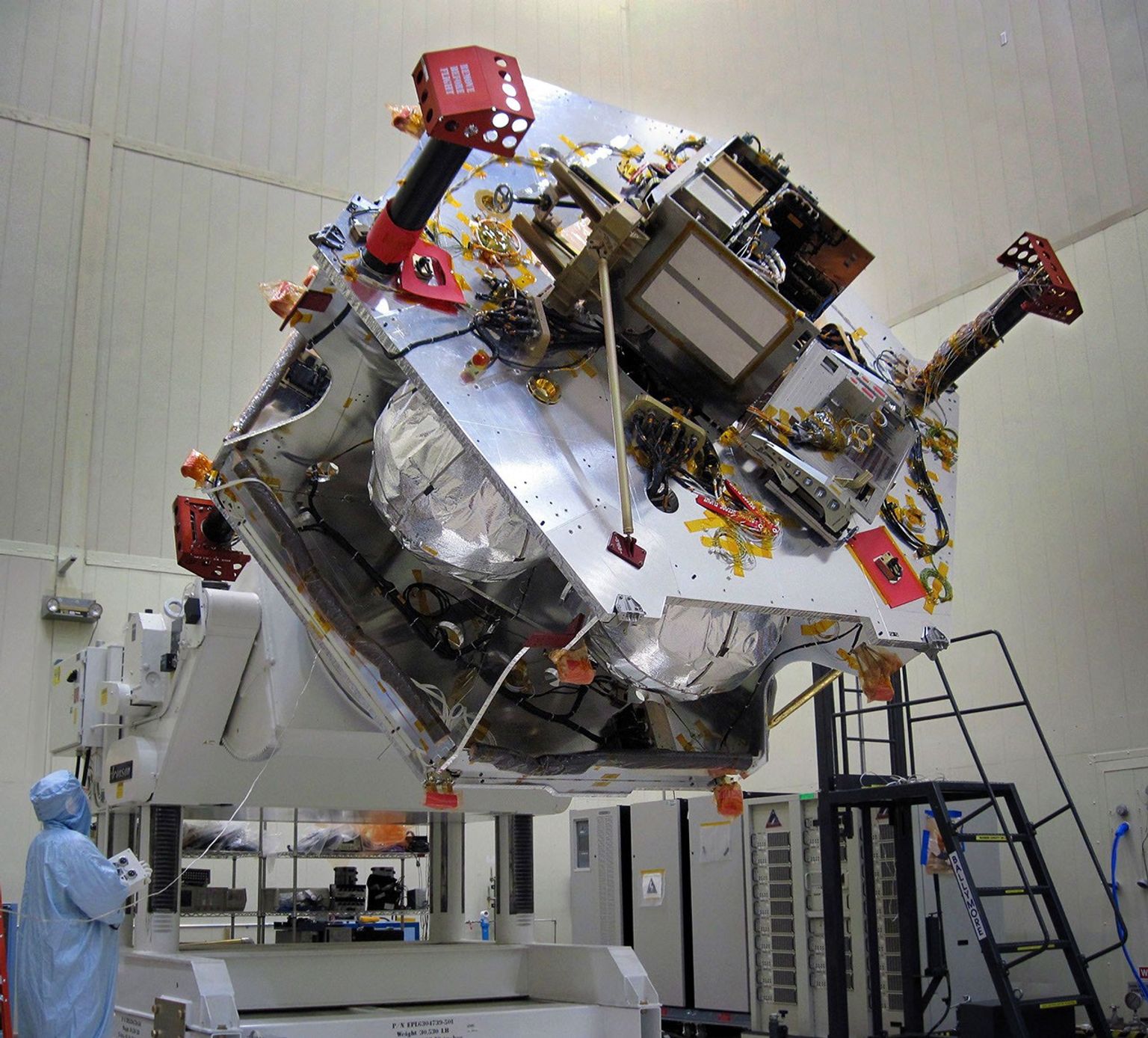 Once the radiation vault was installed on top of the propulsion module, NASA's Juno spacecraft was lifted onto a large rotation fixture. The fixture allows the spacecraft to be turned for convenient access for integrating and testing instruments.