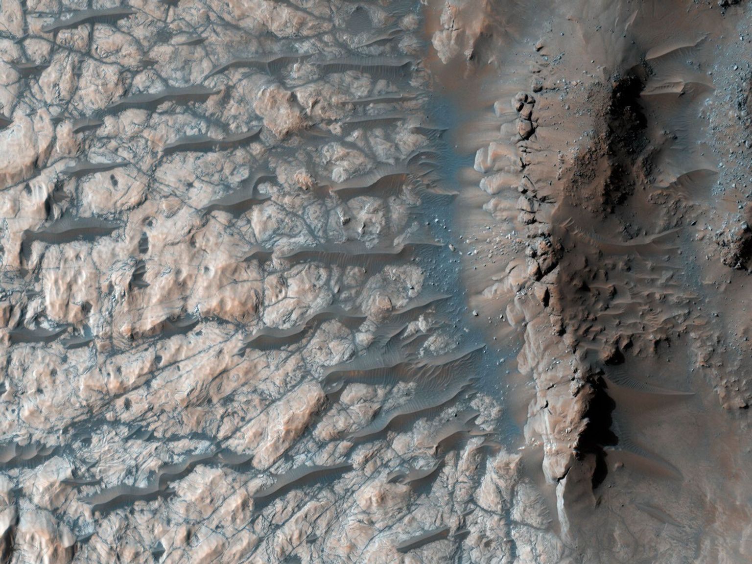 This observation from NASA's Mars Reconnaissance Orbiter shows part of the floor of a large impact crater in the southern highlands, north of the giant Hellas impact basin.