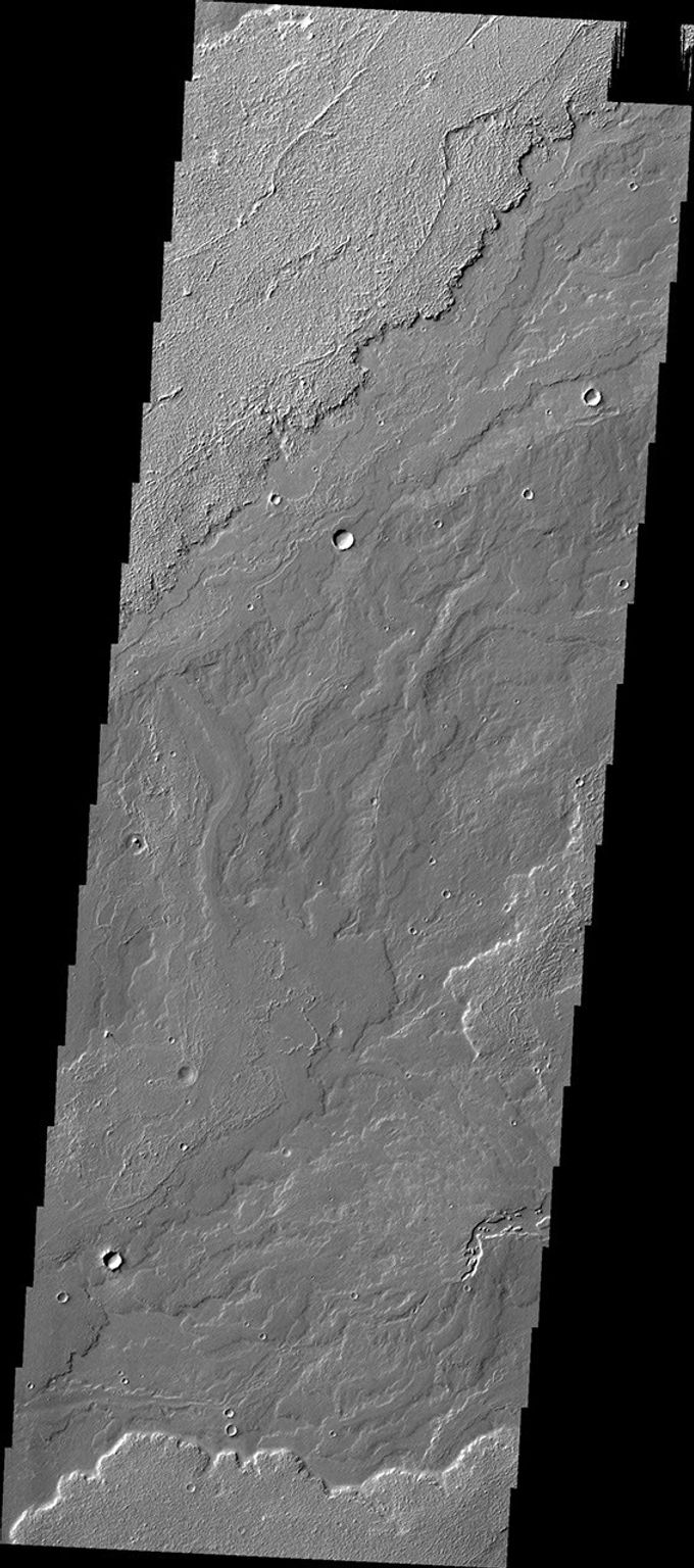 This image, captured by NASA's Mars Odyssey on May 23, 2010 of Daedalia Planum, shows various lava flows from Arsia Mons.