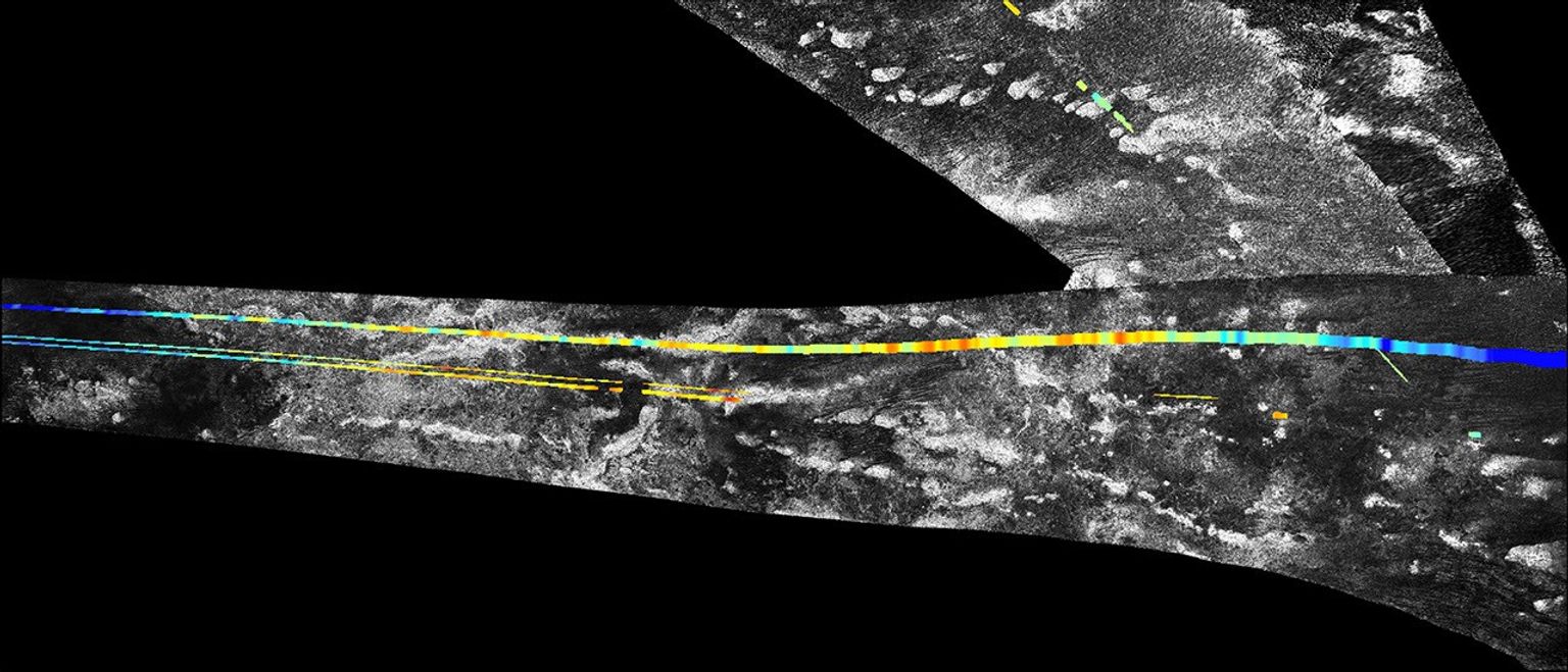 This mosaic, made from radar images obtained by NASA's Cassini spacecraft, shows parallel mountain chains on Saturn's moon Titan, near an equatorial region known as Adiri.