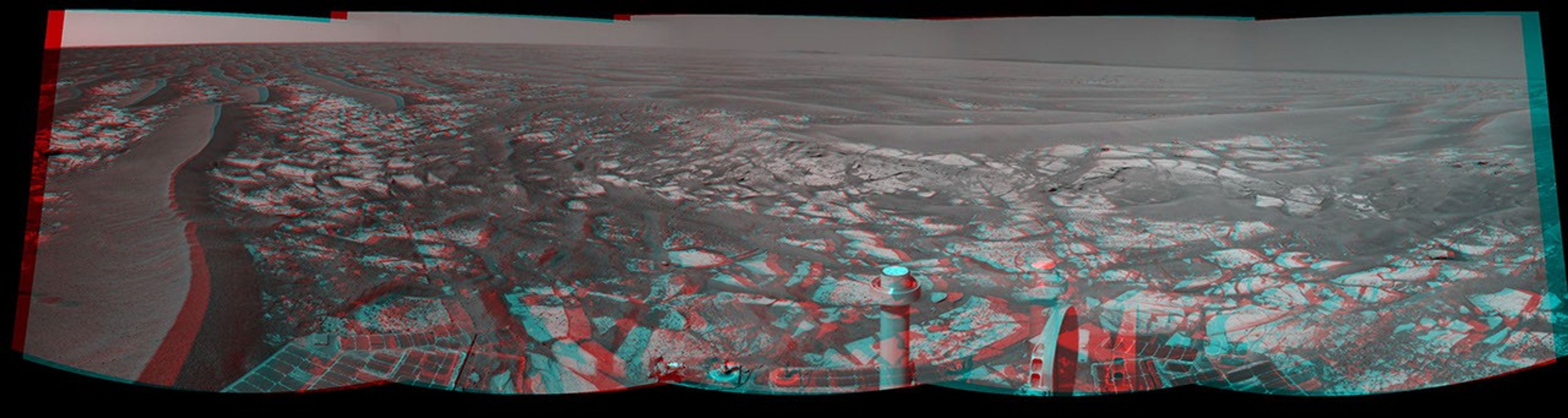 This stereo panorama taken by NASA's Mars Exploration Rover Opportunity includes an outcrop informally called 'Cambridge Bay.' 3D glasses are necessary to view this image.