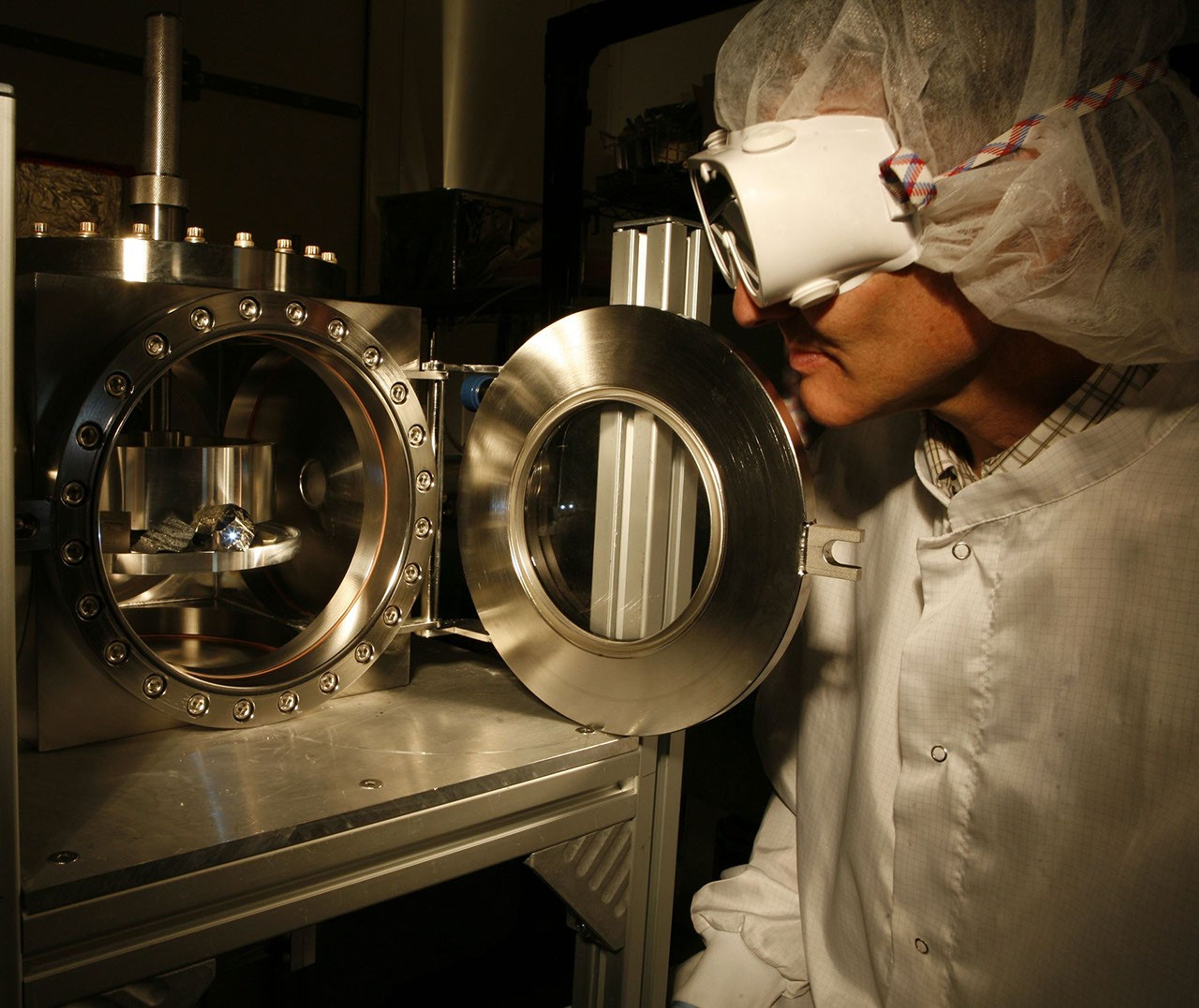 The ChemCam instrument for NASA's Mars Science Laboratory mission uses a pulsed laser beam to vaporize a pinhead-size target, producing a flash of light from the ionized material (plasma) that can be analyzed to identify chemical elements in the target.