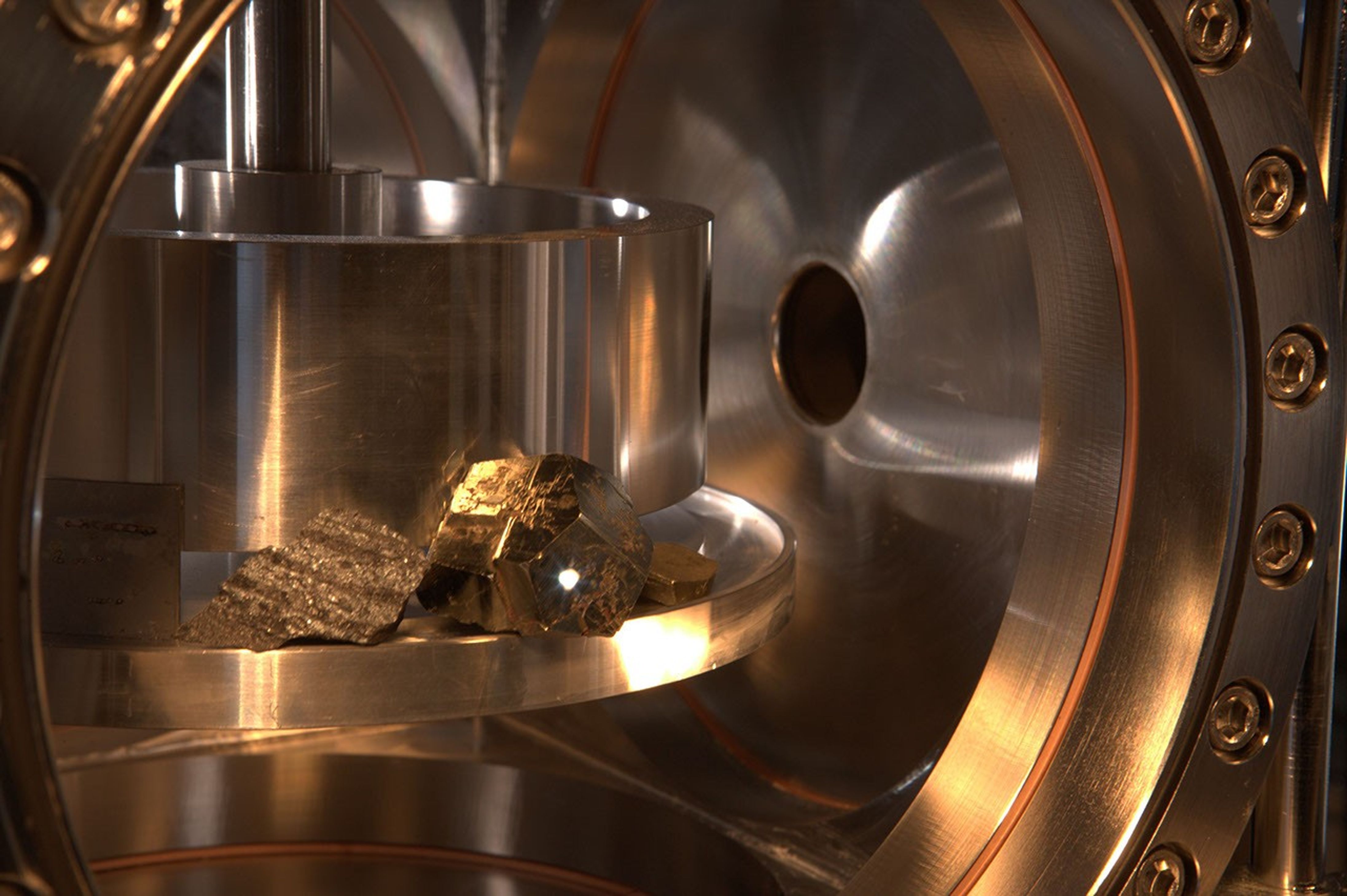 The ChemCam instrument for NASA's Mars Science Laboratory mission uses a pulsed laser beam to vaporize a pinhead-size target, producing a flash of light from the ionized material (plasma) that can be analyzed to identify chemical elements in the target.