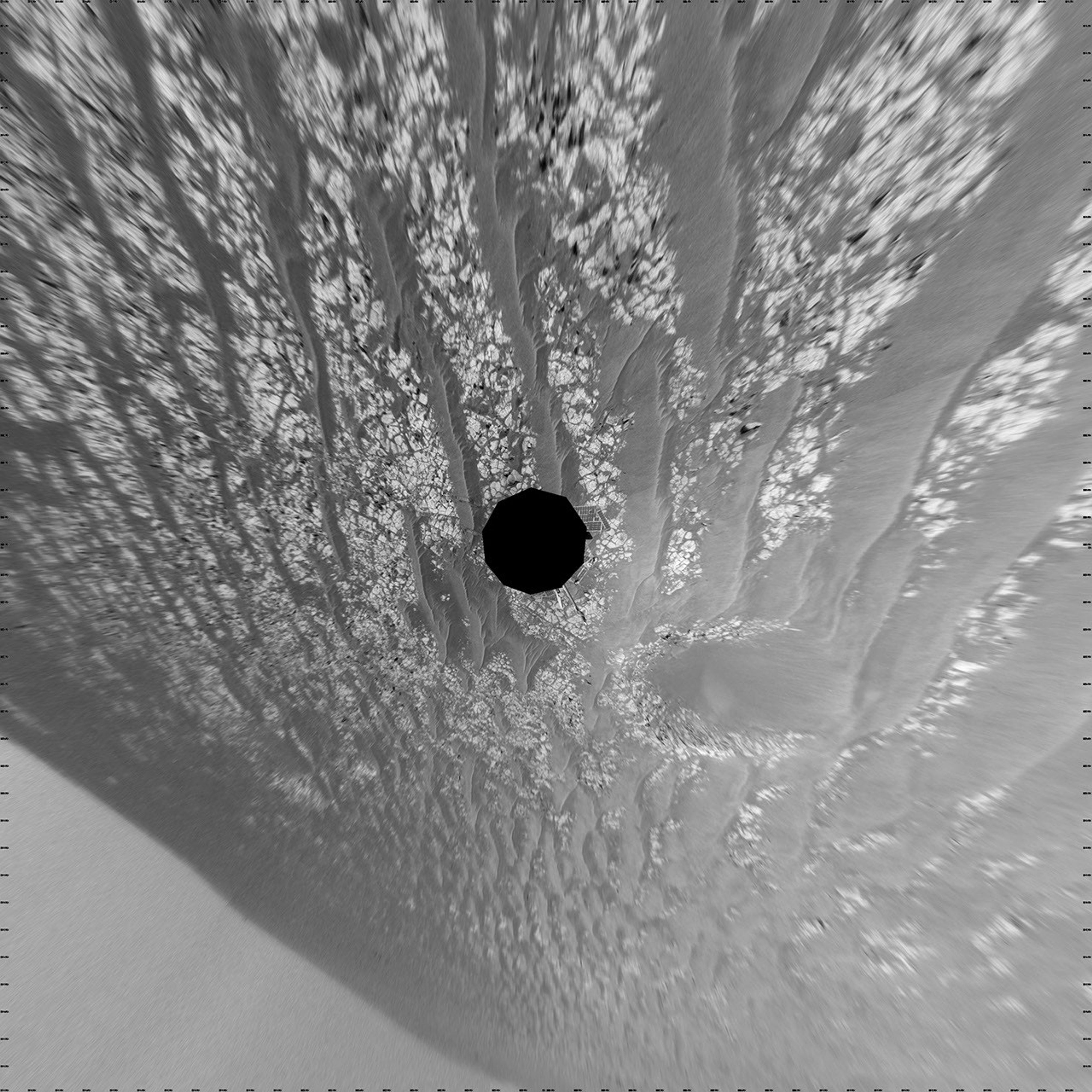 This mosaic of images from NASA's Mars Exploration Rover Opportunity shows surroundings of the rover's location on Sept. 16, 2010. The terrain includes light-toned bedrock and darker ripples of wind-blown sand.