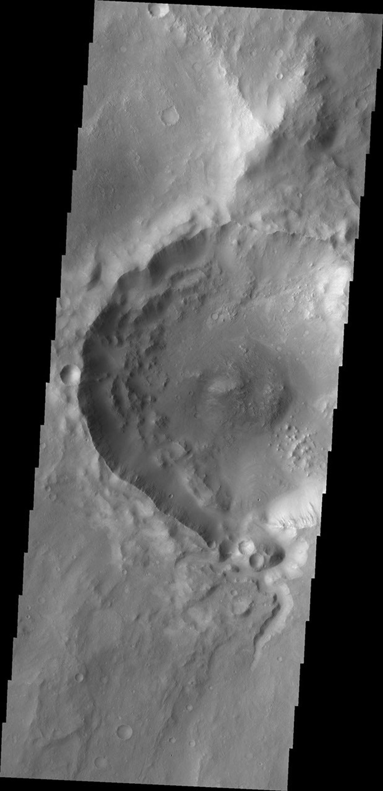 This image from NASA's Mars Odyssey shows a small channel entering the south side of Balvicar Crater.