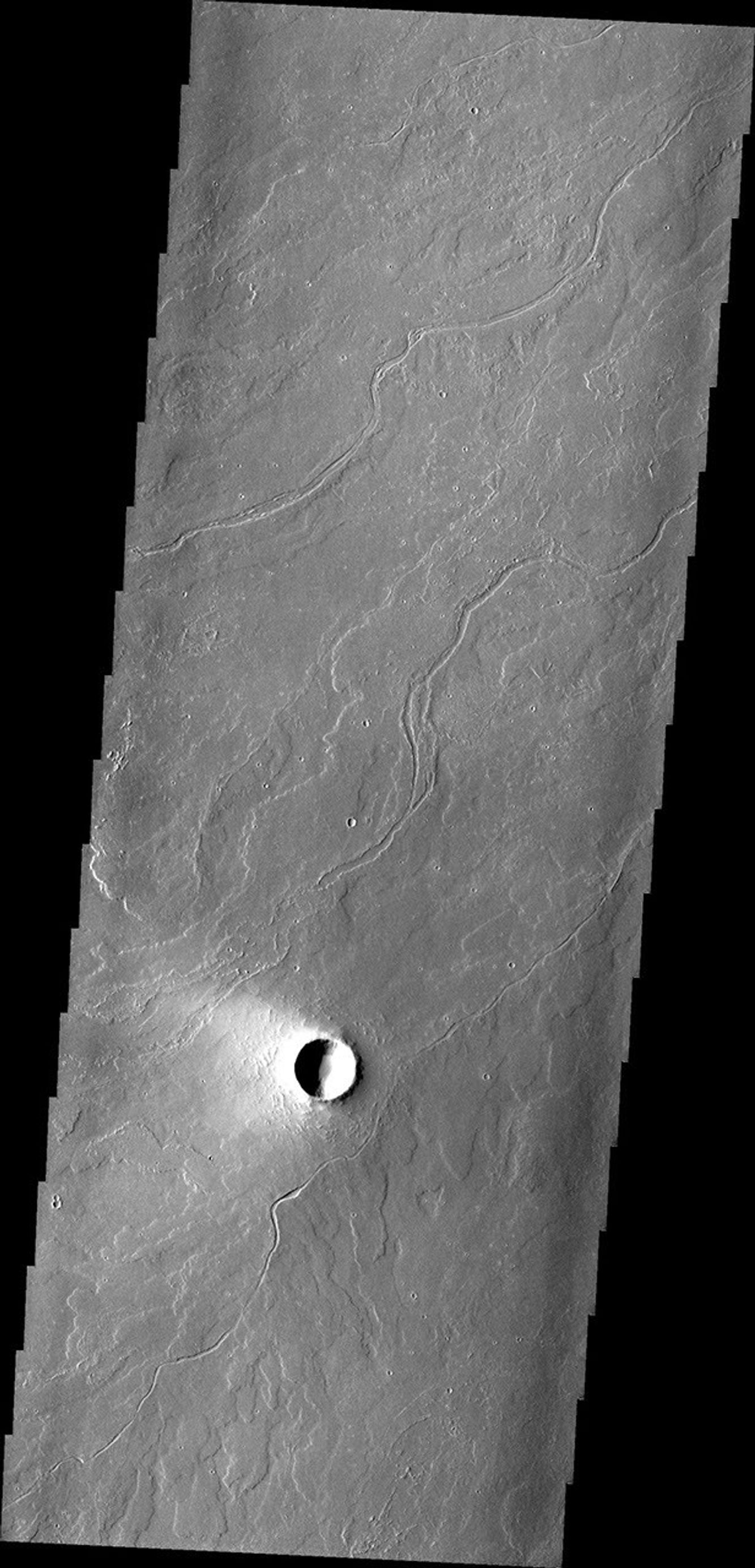 This region of Tharsis near Olympus Mons contains subtle features showing its lava flow origin. Note the 'softened' flow fronts and lava channels in this image captured by NASA's Mars Odyssey spacecraft.