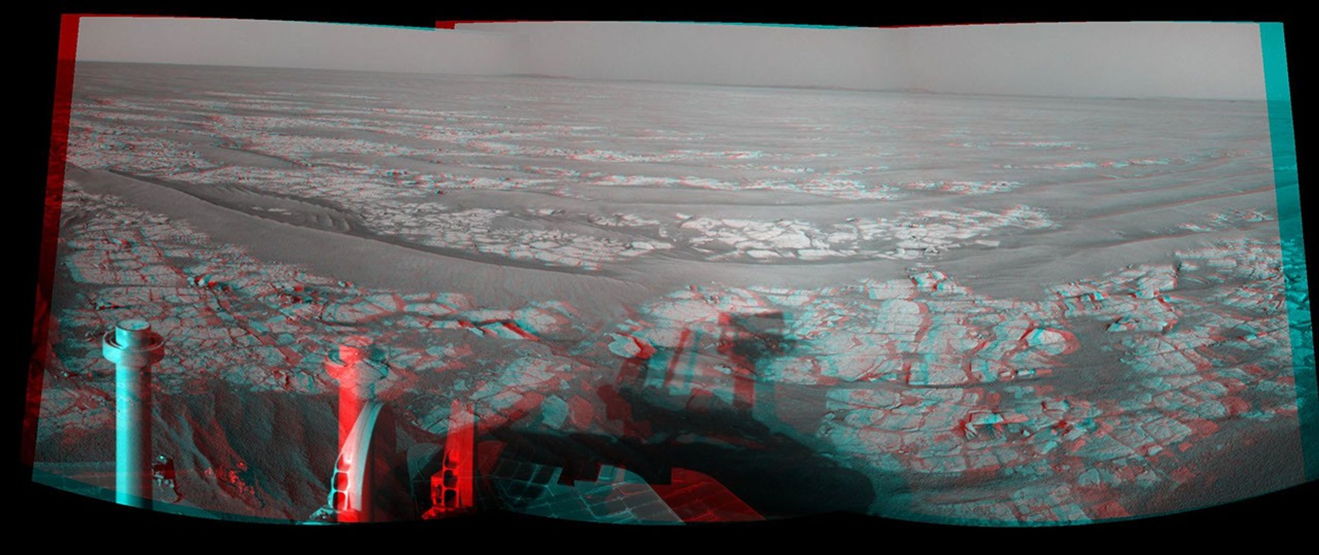 This stereo mosaic of images from NASA's Mars Exploration Rover Opportunity shows surroundings of the rover's location following an 93.3-meter (306-foot) drive east-northeastward on Oct. 6, 2010. 3D glasses are necessary to view this image.