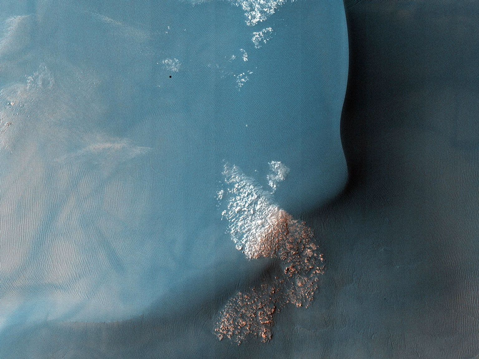 This observation from NASA's Mars Reconnaissance Orbiter shows a Southern hemisphere crater with gullies, dunes, periglacial modification, bright rock deposits, and dust devil tracks.