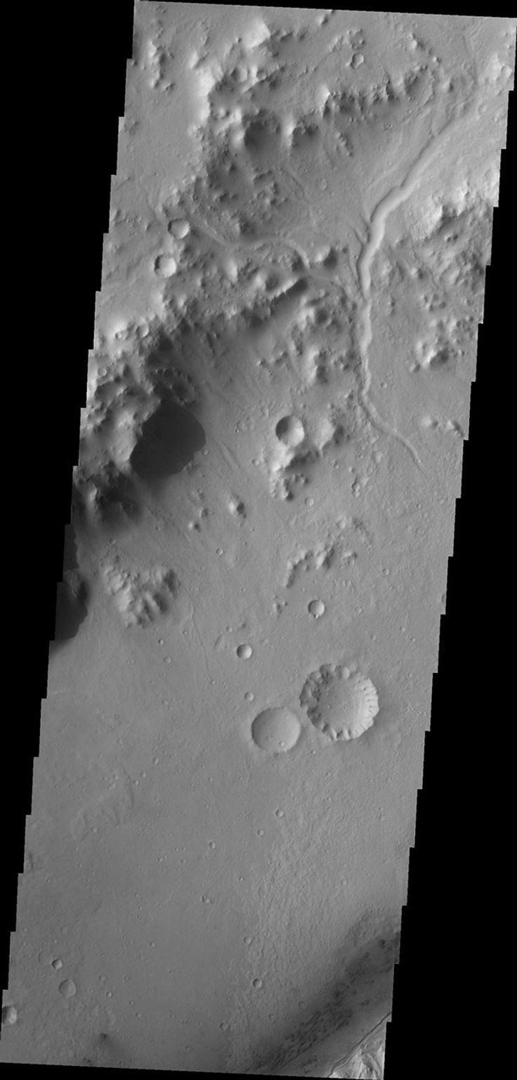 Small channels dissect the northwestern rim of Gale Crater in this image captured by NASA's Mars Odyssey.