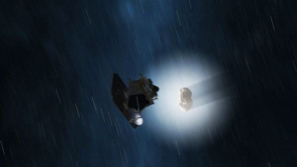 This artist's concept shows a view of NASA's EPOXI mission spacecraft during its Nov. 4, 2010 flyby of comet Hartley 2. The fluffy shell around the comet, called a coma, is made up of gas and dust that blew off the comet's core, or nucleus.