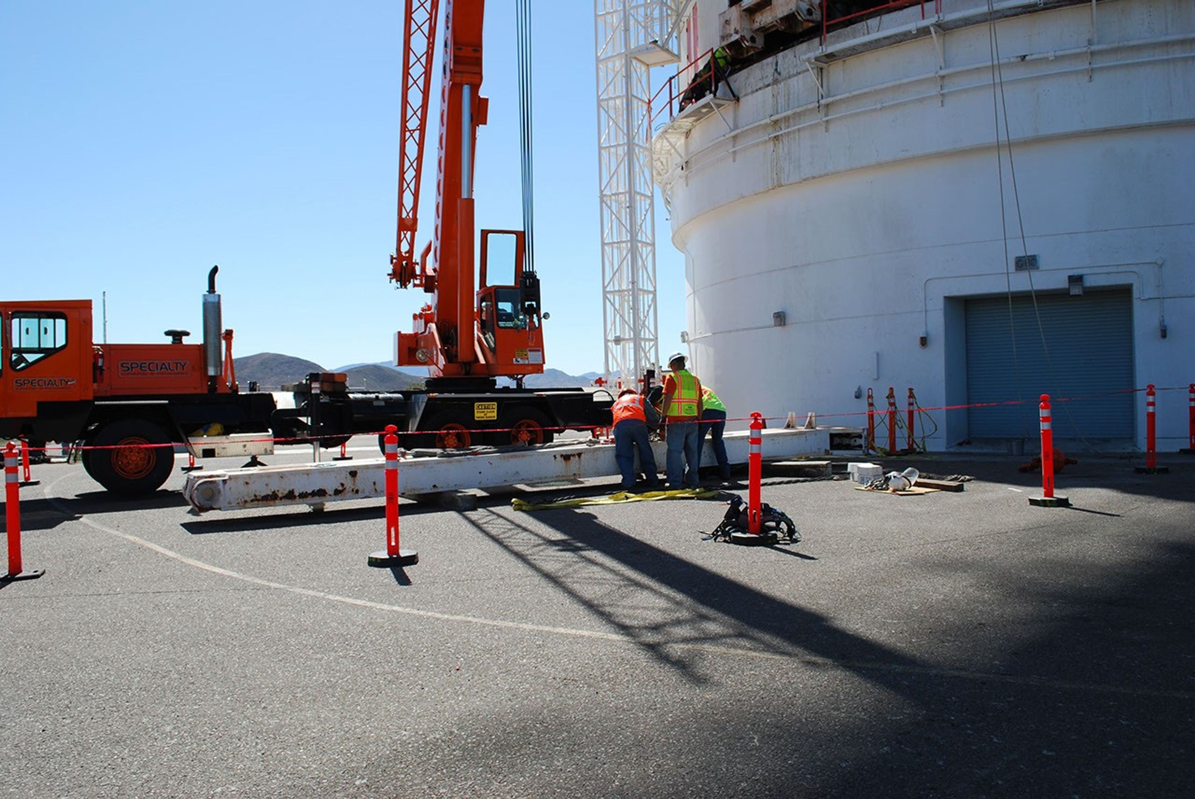 Workers at NASA's Deep Space Network's Goldstone Deep Space Communications Complex prepare a support leg that would help raise a portion of the giant 'Mars antenna.'