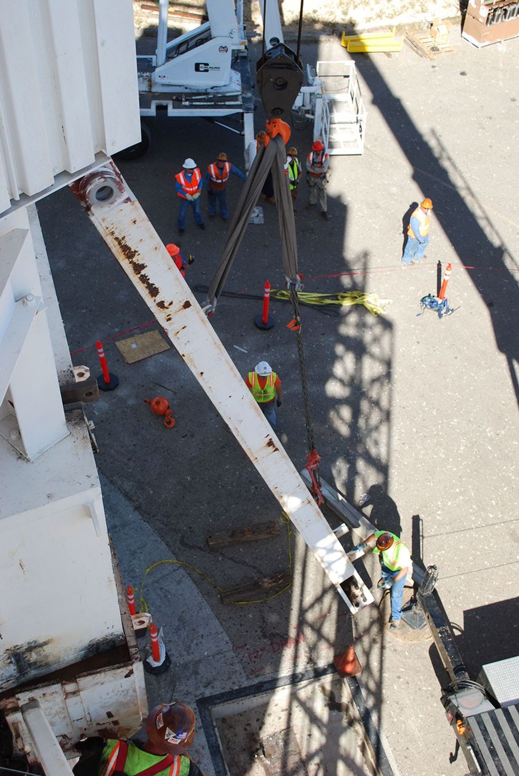 Workers at NASA's Deep Space Network's Goldstone Deep Space Communications Complex put into place a set of support legs to help hold up a portion of the giant 'Mars antenna' on May 4, 2010.