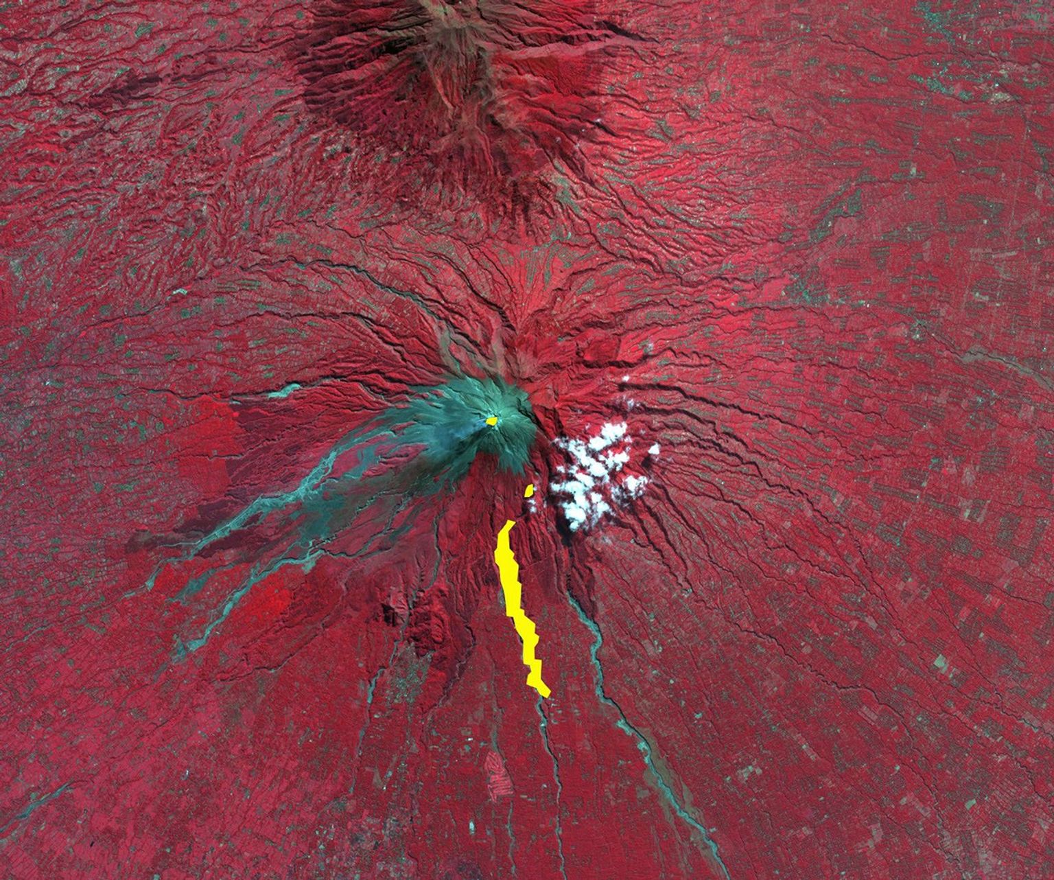 The ASTER instrument onboard NASA's Terra's spacecraft imaged the hot volcanic flow that resulted from collapse of the summit lava dome from the Merapi volcano in Indonesia that erupted on Oct. 26, 2010.