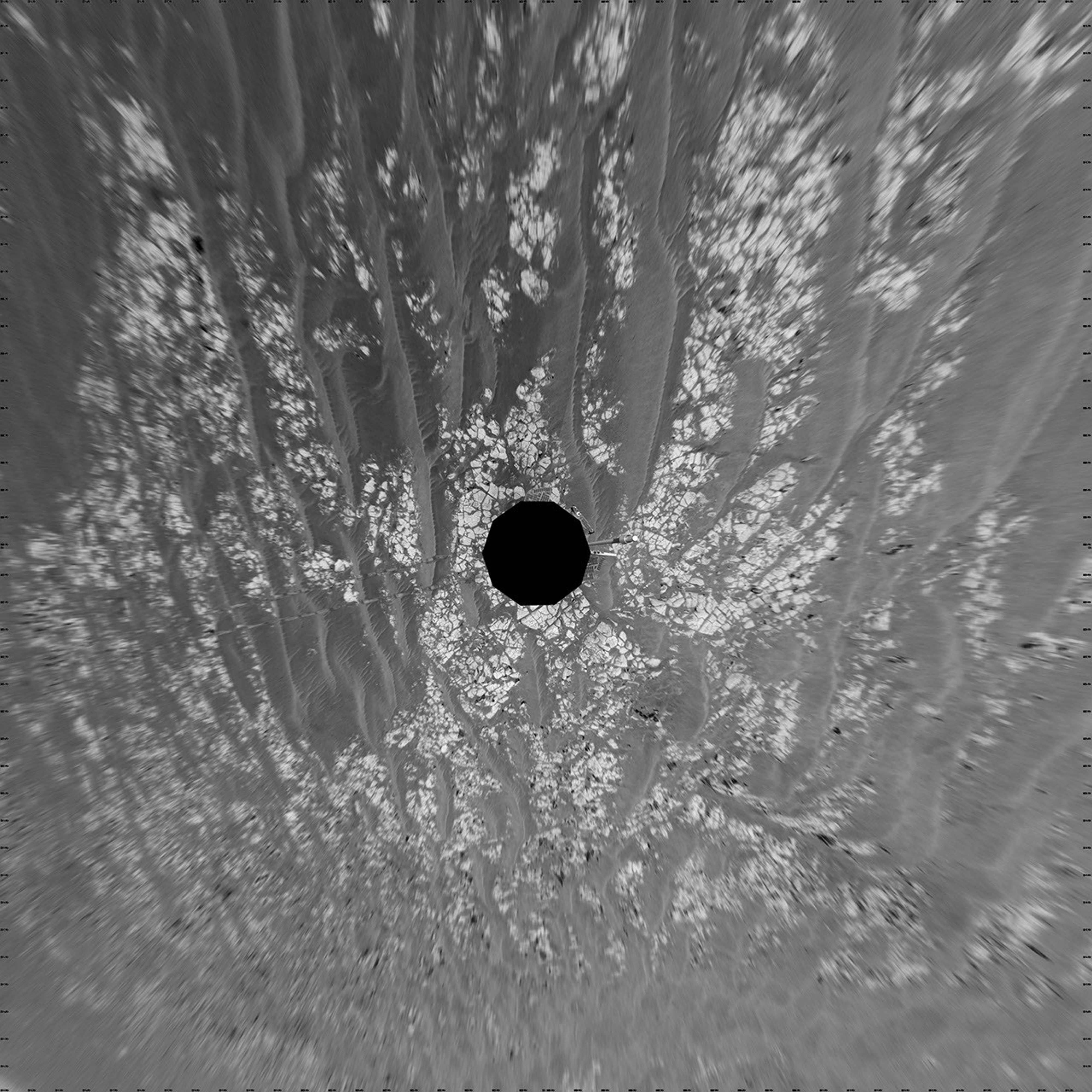 In this vertical projection image taken on Oct. 17, 2009, NASA's Mars Exploration Rover Opportunity shows terrain which includes light-toned bedrock and darker ripples of wind-blown sand.