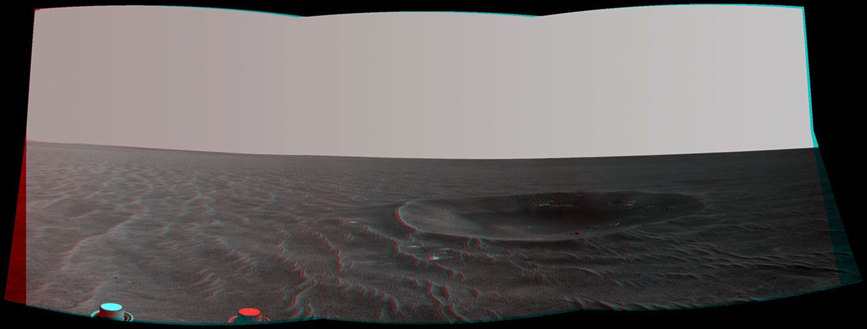 'Yankee Clipper' crater on Mars carries the name of the command and service module of NASA's 1969 Apollo 12 mission to the moon. NASA's Mars Exploration Rover Opportunity recorded this stereo view on Nov. 4, 2010. 3D glasses are necessary.