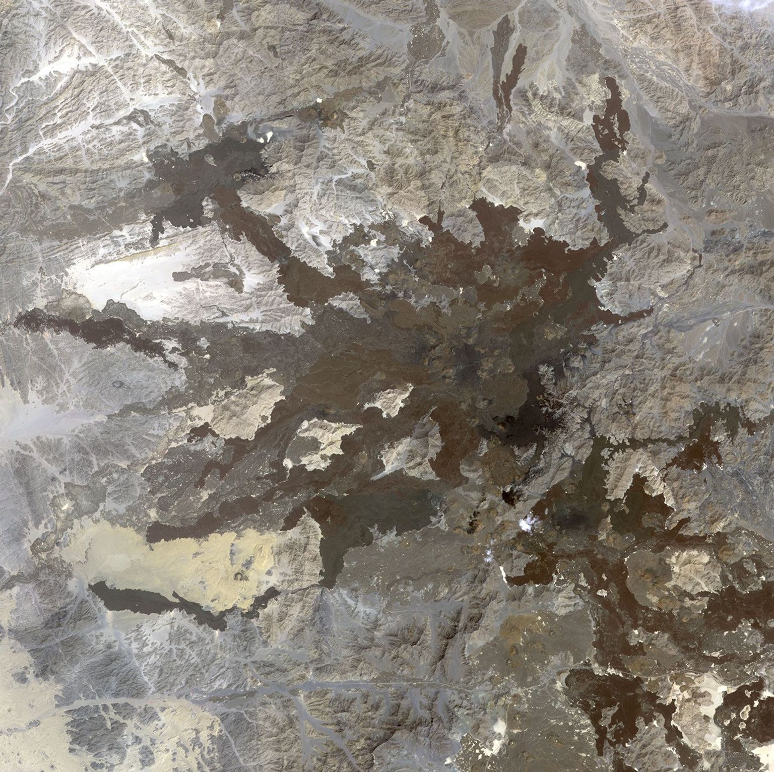 This image from NASA's Terra spacecraft shows a northwest area of Saudi Arabia, Harrat Lunayyir, that reveals that the area is unexpectedly volcanically active.