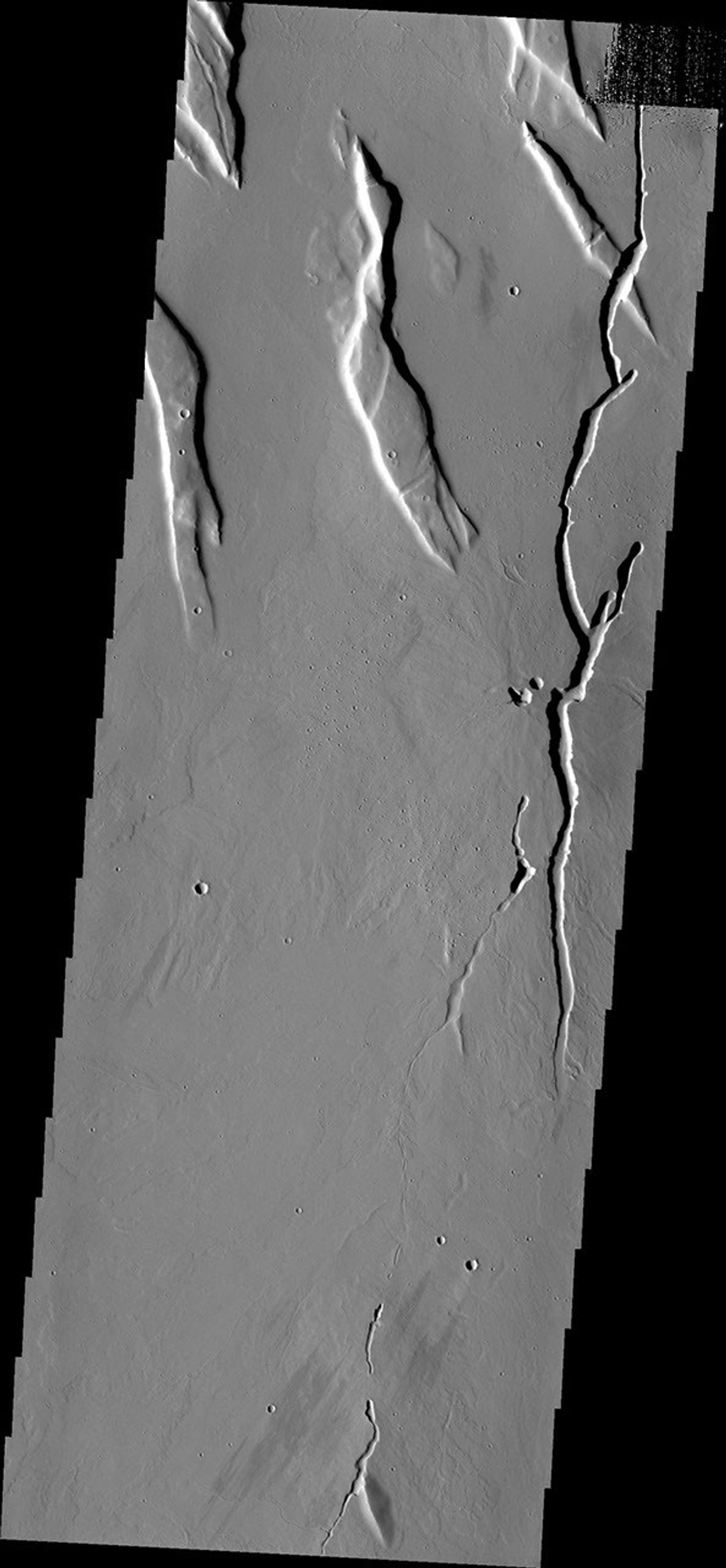 The collapse features in this image captured by NASA's Mars Odyssey are located in the volcanic flows south of Alba Mons.