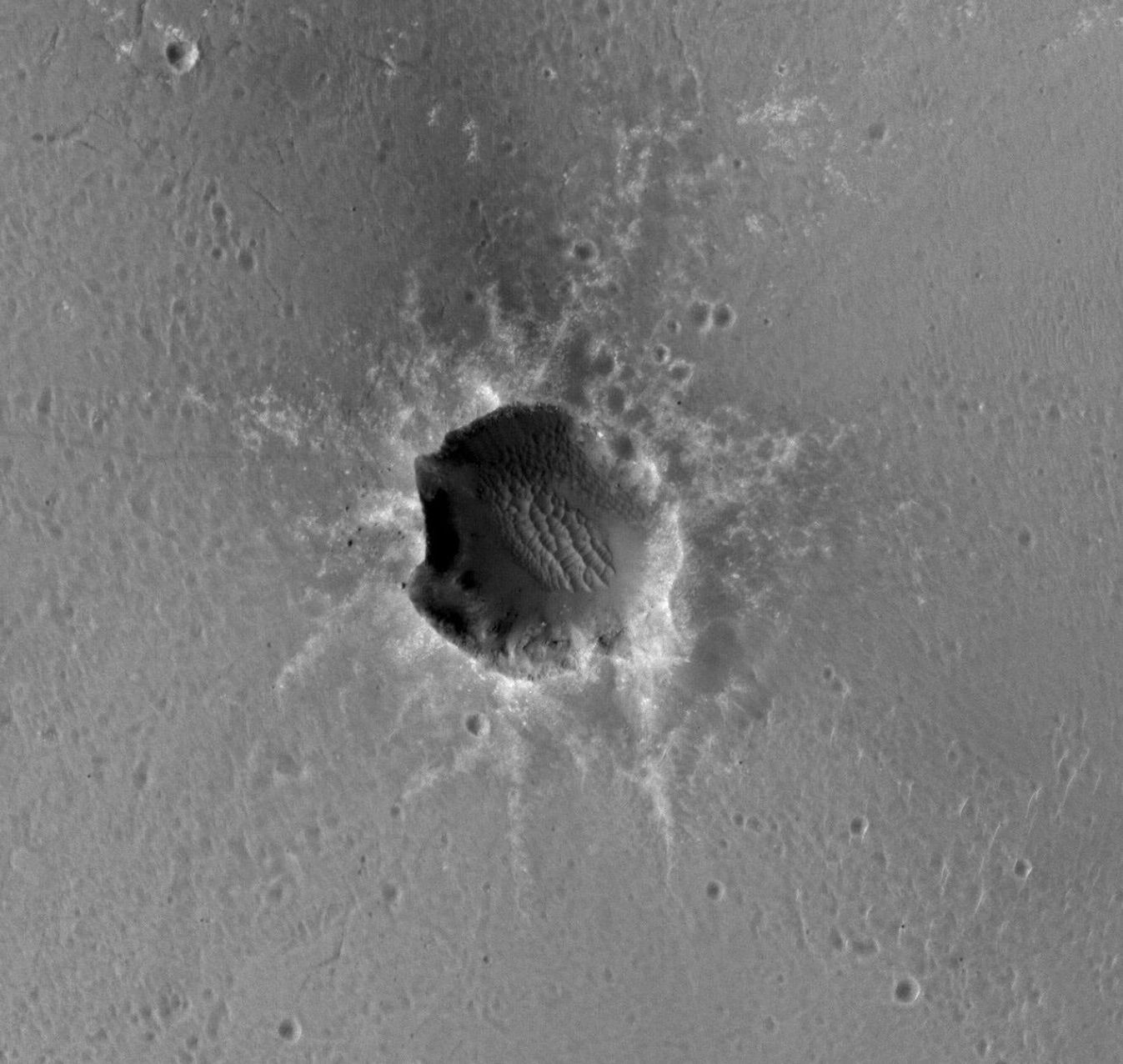 NASA's Mars Reconnaissance Orbiter acquired this image of the Opportunity rover on the southwest rim of 'Santa Maria' crater on New Year's Eve 2010. Opportunity is imaging the crater's interior to better reveal the geometry of rock layers.
