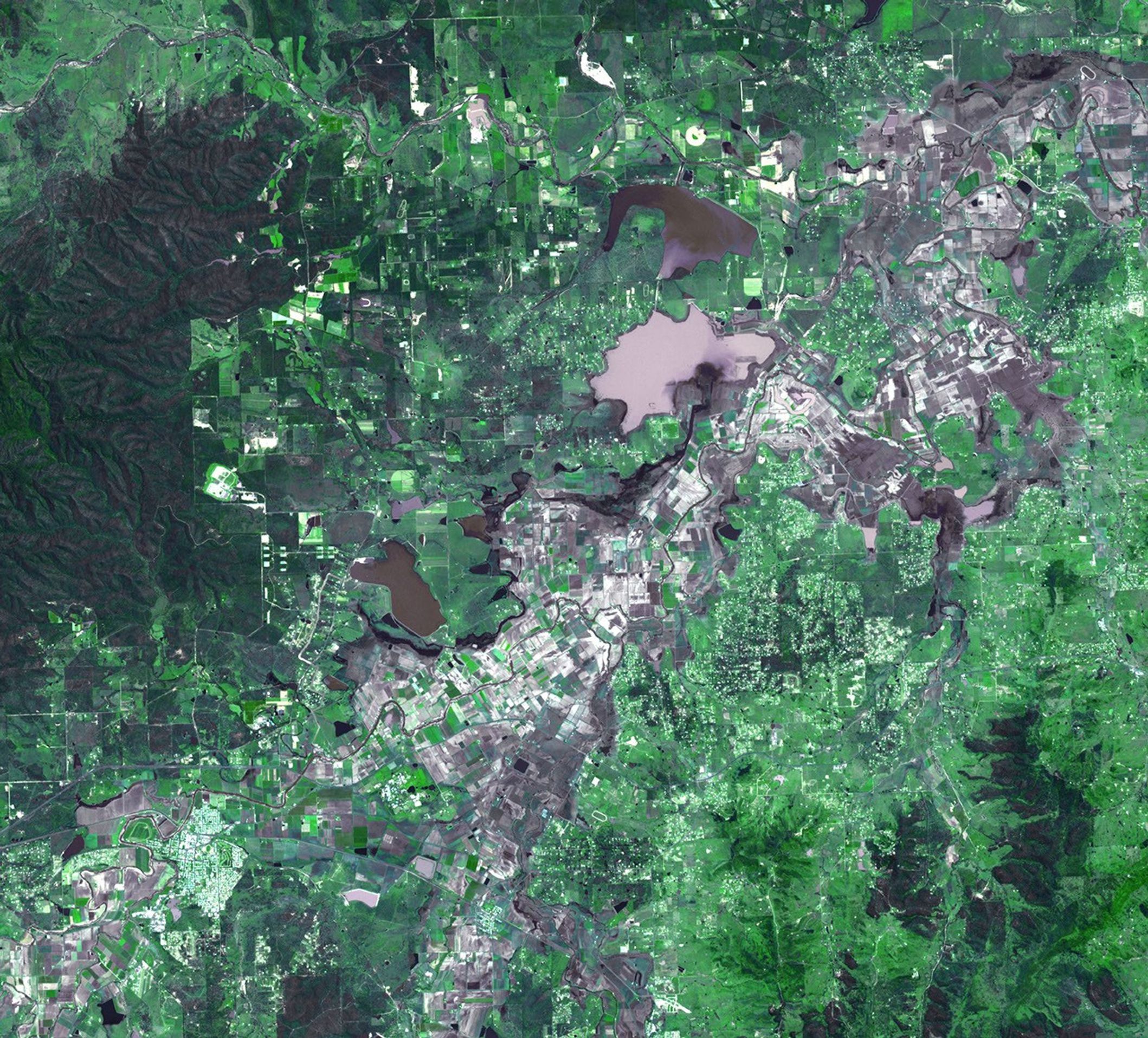 On January 17, 2011, the Advanced Spaceborne Thermal Emission and Reflection Radiometer (ASTER) instrument on NASA's Terra spacecraft captured this image of the inundation west of Brisbane, Queensland, Australia.