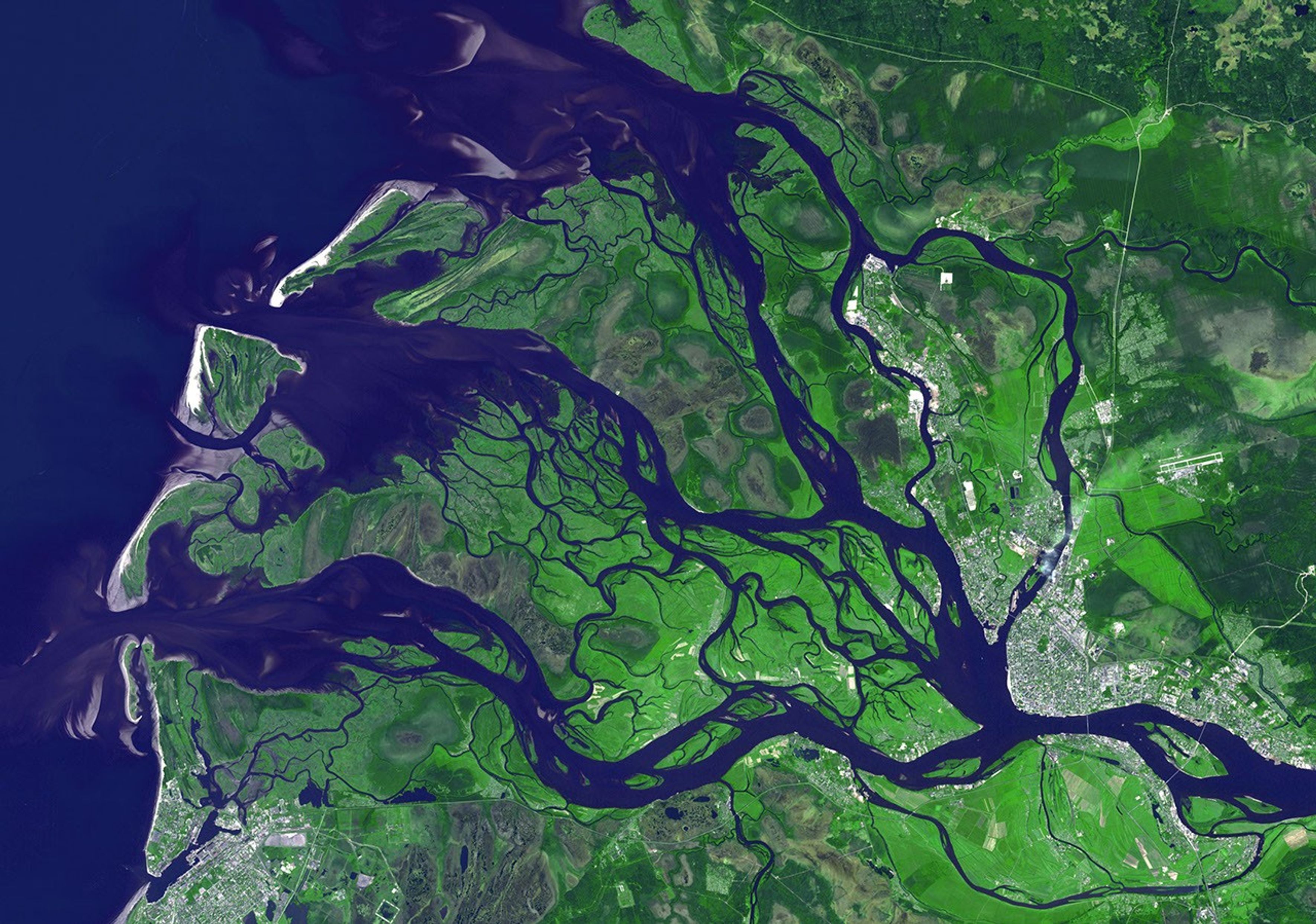 NASA's Terra spacecraft captured this image of the city of Arkhangelsk (or Archangel in English) and administrative capital of Archangelsk Oblast, Russia. It is situated on both banks of the Dvina River near where it flows into the White Sea.