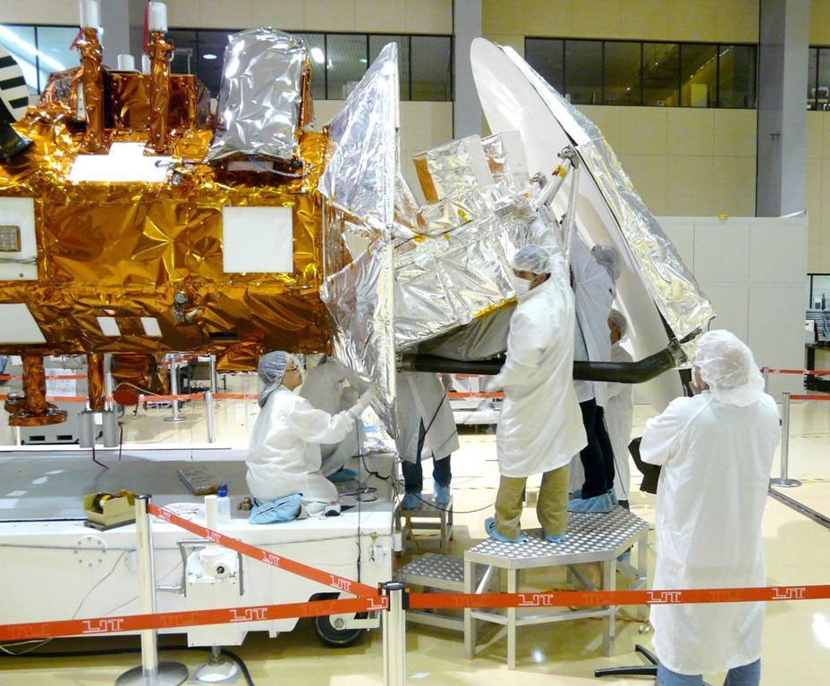 Technicians from NASA's Jet Propulsion Laboratory in Pasadena, Calif., install thermal blankets on the Aquarius instrument at Brazil's National Institute for Space Research.