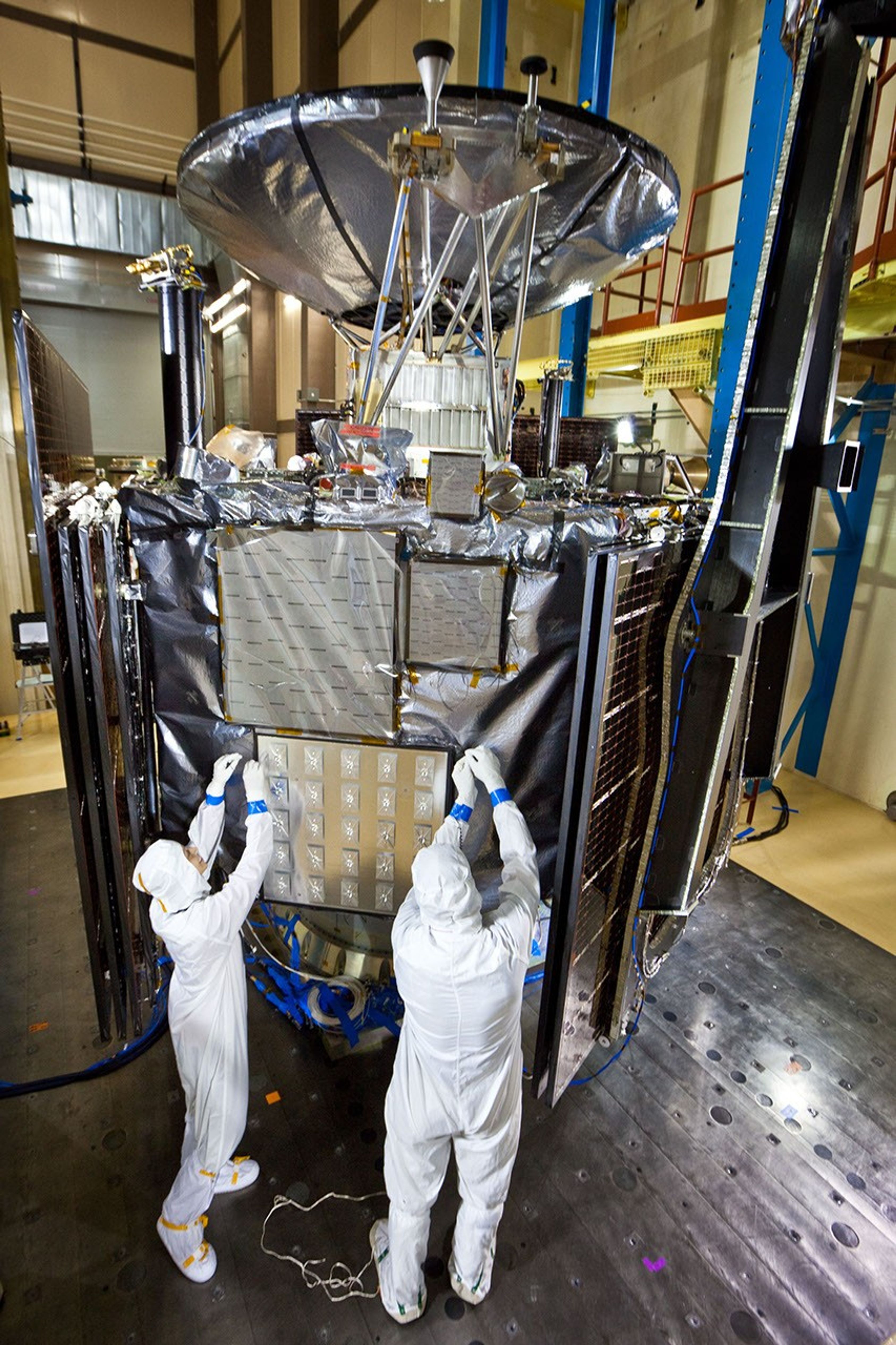 Technicians inspect NASA's Juno spacecraft and its science instruments following acoustics testing at Lockheed Martin Space Systems in Denver, Colo. on Jan. 26, 2011.