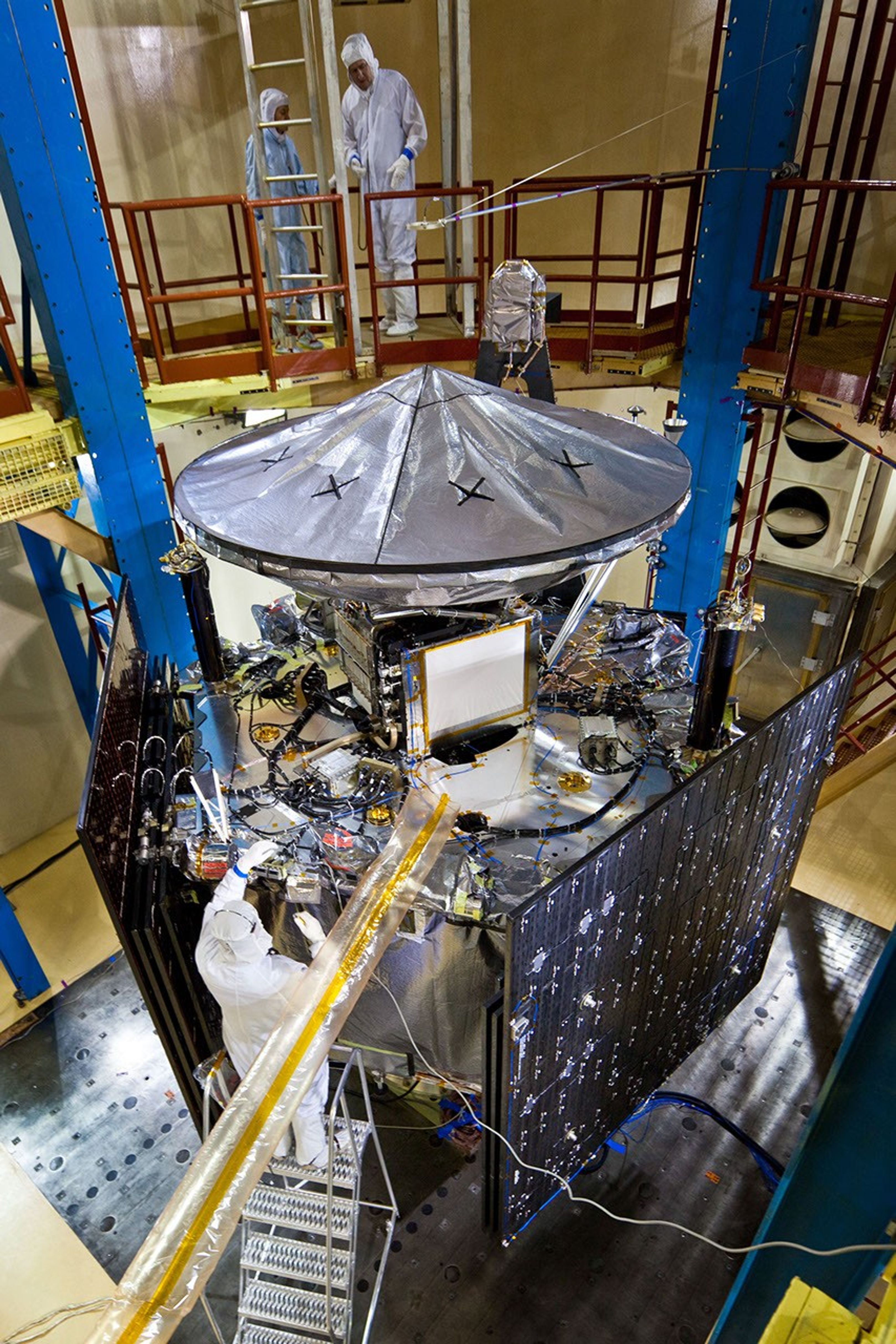 Technicians inspect NASA's Juno spacecraft and its science instruments following acoustics testing at Lockheed Martin Space Systems in Denver, Colo. on Jan. 26, 2011.