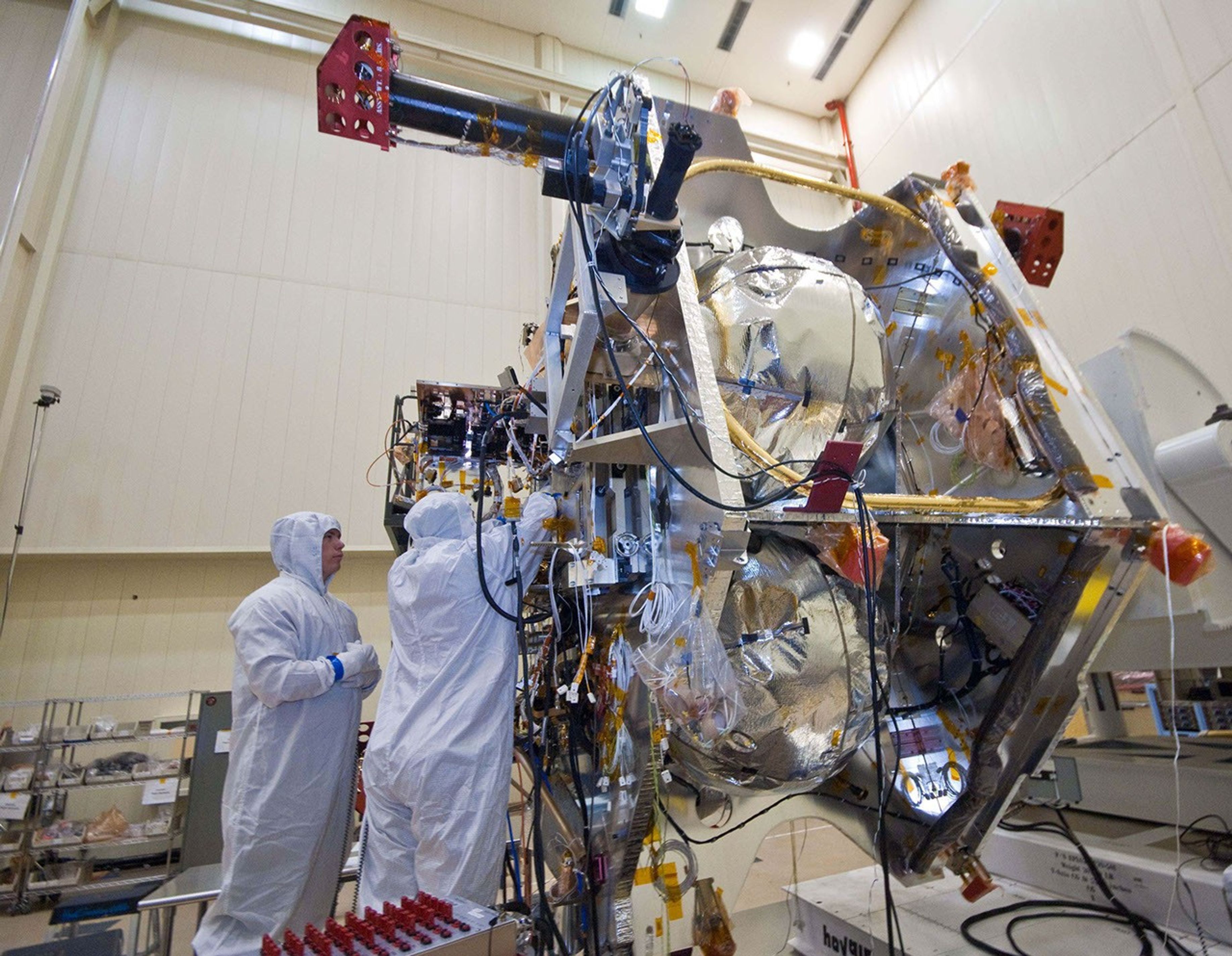 Technicians install components that will aid with guidance, navigation and control of NASA's Juno spacecraft.