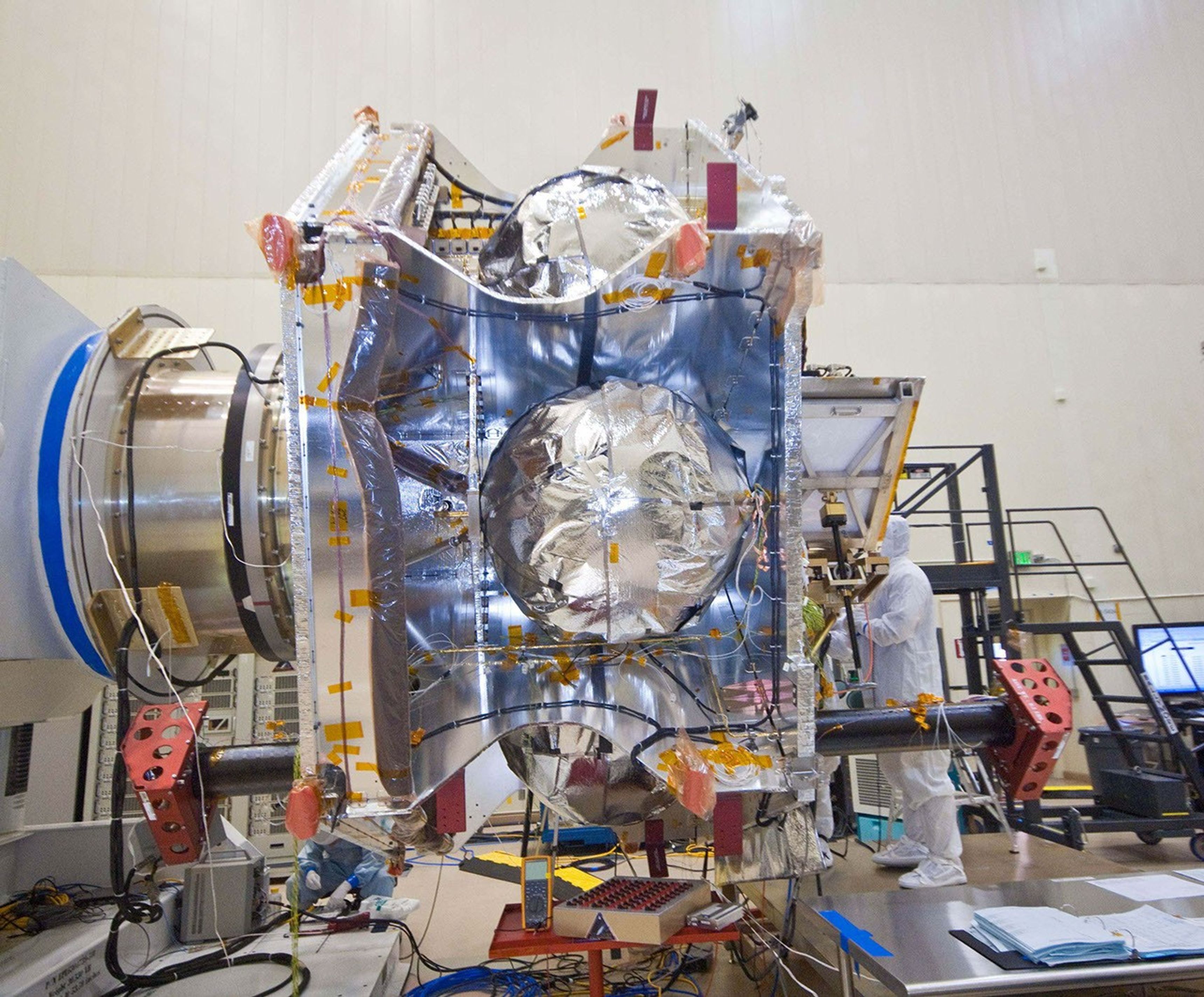 An exposed, side view of NASA's Juno spacecraft during its assembly features three of the spacecraft's spherical propellant tanks.