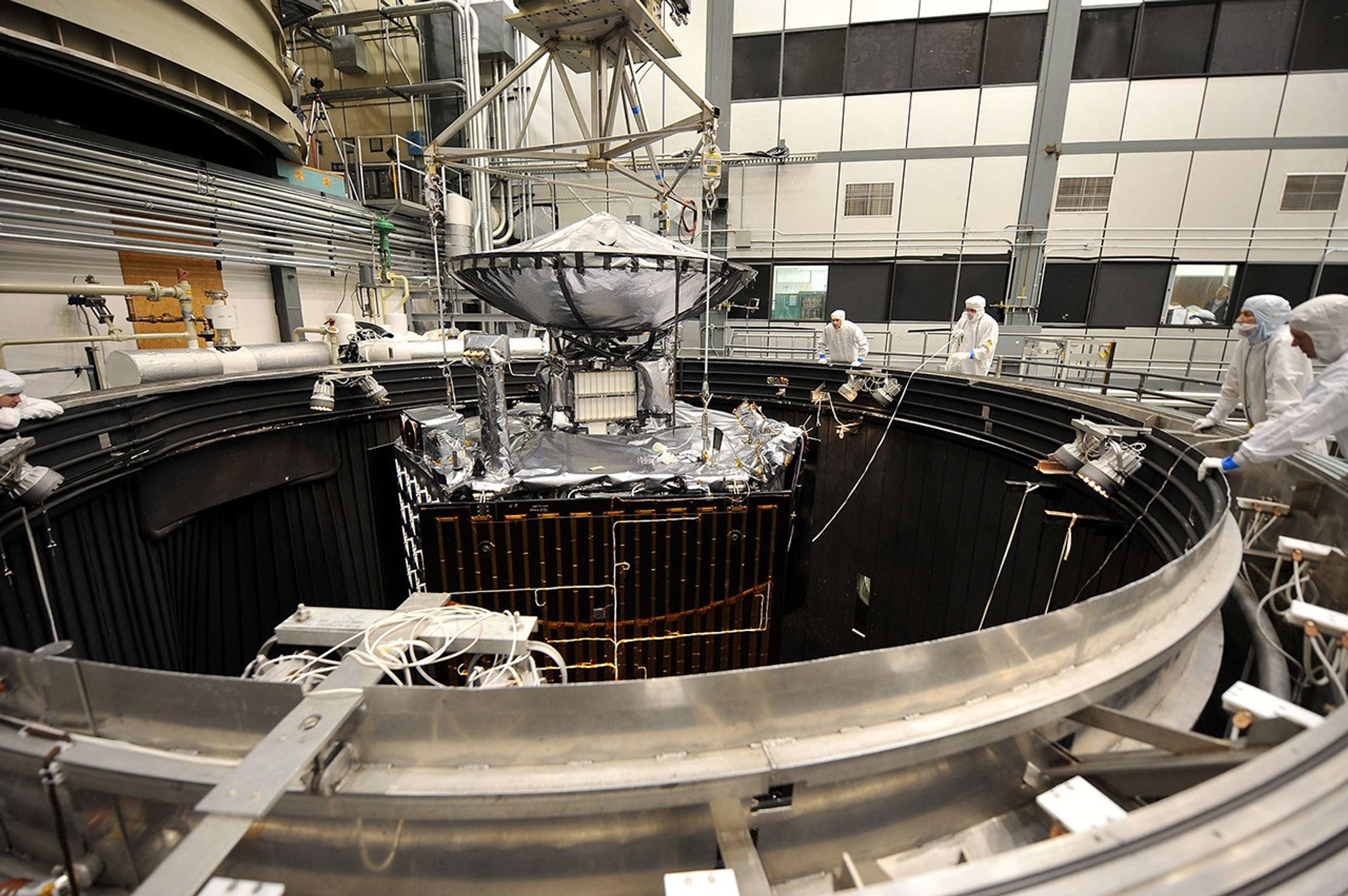 NASA's Juno spacecraft is raised out of a thermal vacuum chamber following tests that simulated the environment of space over the range of conditions the probe will encounter during its mission.