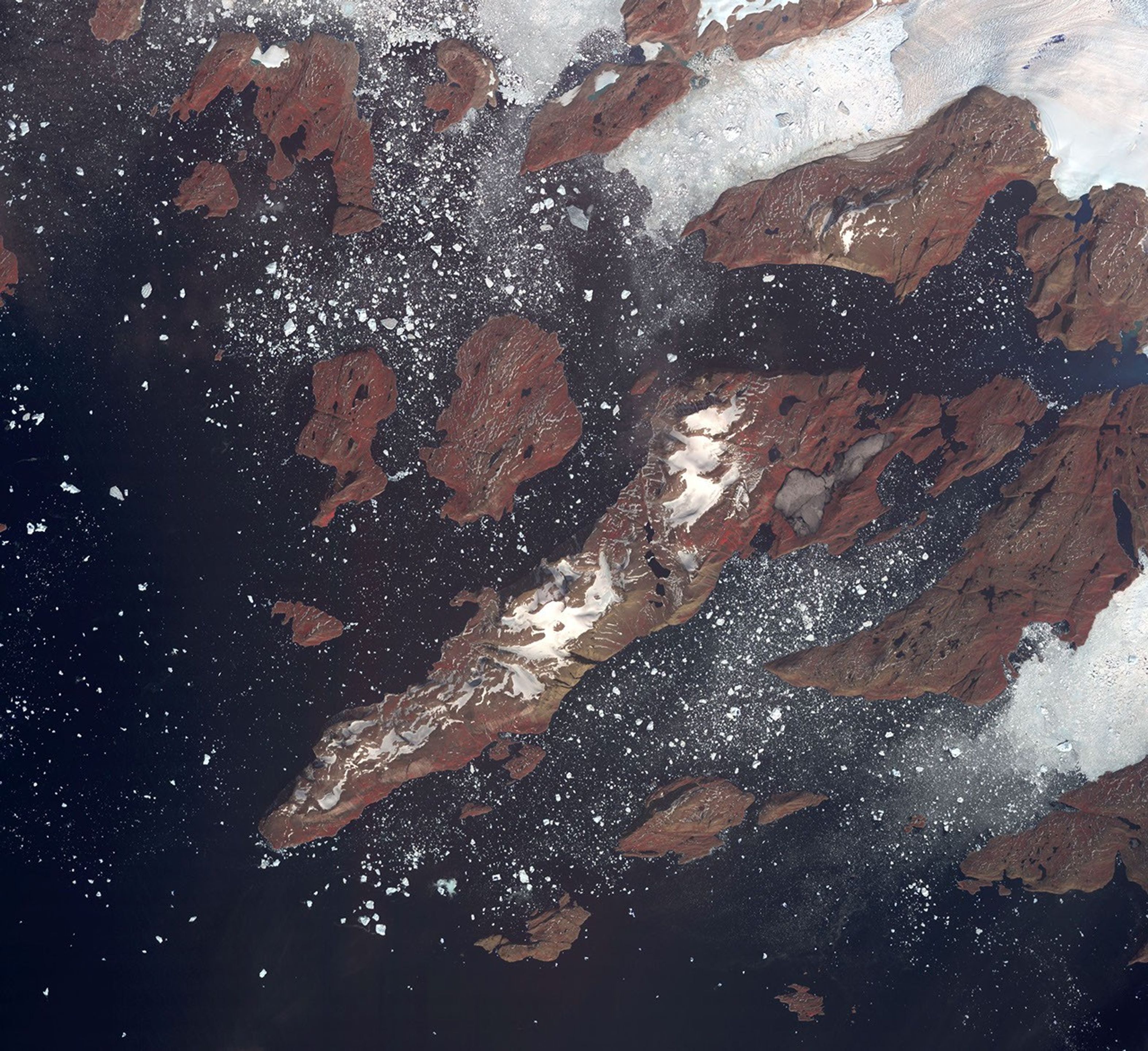 Acquired by NASA's Terra spacecraft, this image shows the west coast of Greenland, one of Earth's premiere incubators for icebergs -- large blocks of land ice that break off from glaciers or ice shelves and float in the ocean.