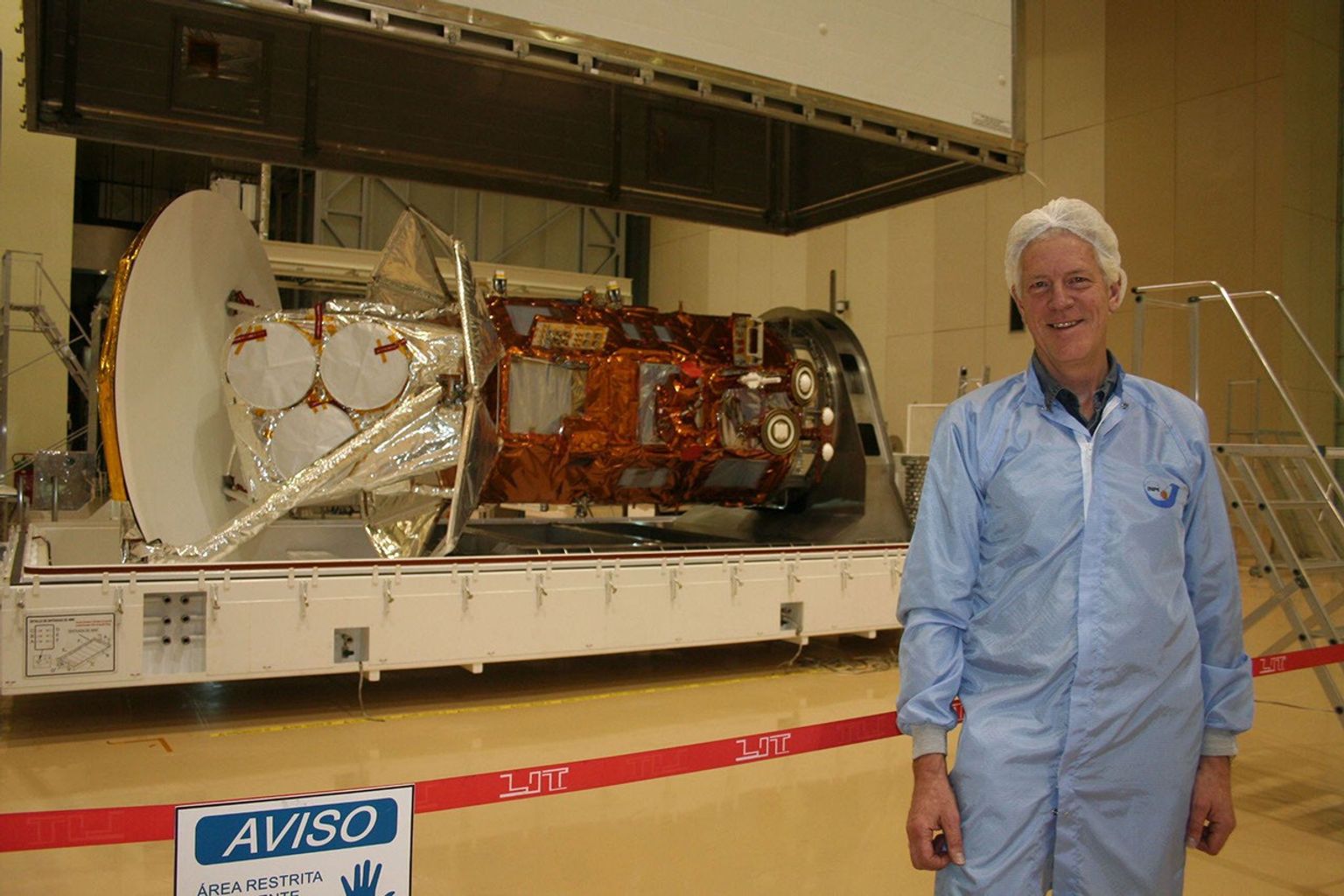 NASA's Aquarius Principal Investigator Gary Lagerloef photographed in front of the Aquarius/SAC-D satellite observatory as it is being readied for transportation from Brazil to Vandenberg Air Force Base in California for a June 2011 launch.