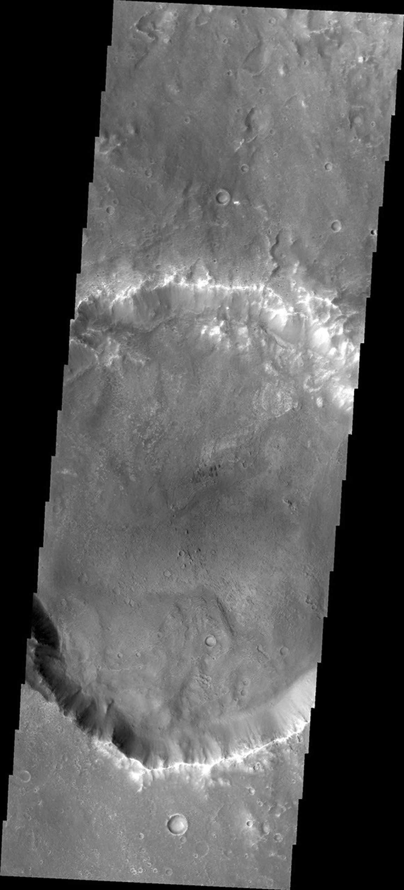 As wind is the only active geologic process on Mars today, sand and dust continue to be moved around the surface. Most craters host a sand dune or two, like this unnamed crater in Tyrrhena Terra. This image is from NASA's 2001 Mars Odyssey.