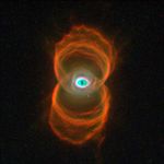 This Hubble telescope snapshot of MyCn18, a young planetary nebula, reveals that the object has an hourglass shape with an intricate pattern of 'etchings' in its walls. A planetary nebula is the glowing relic of a dying, Sun-like star.